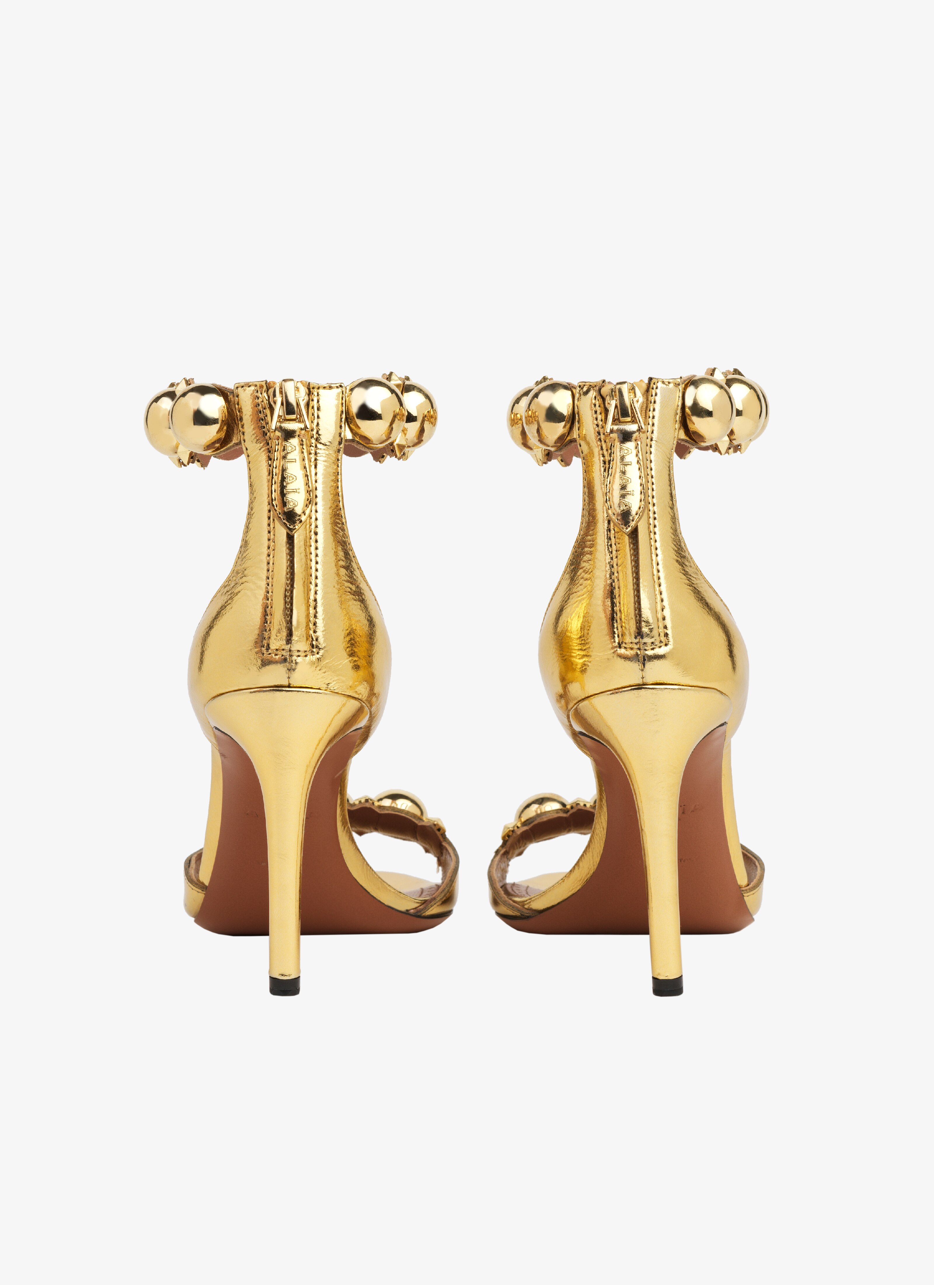 ALAÏA GOLD BOMBE SANDALS IN METALLIC GOATSKIN