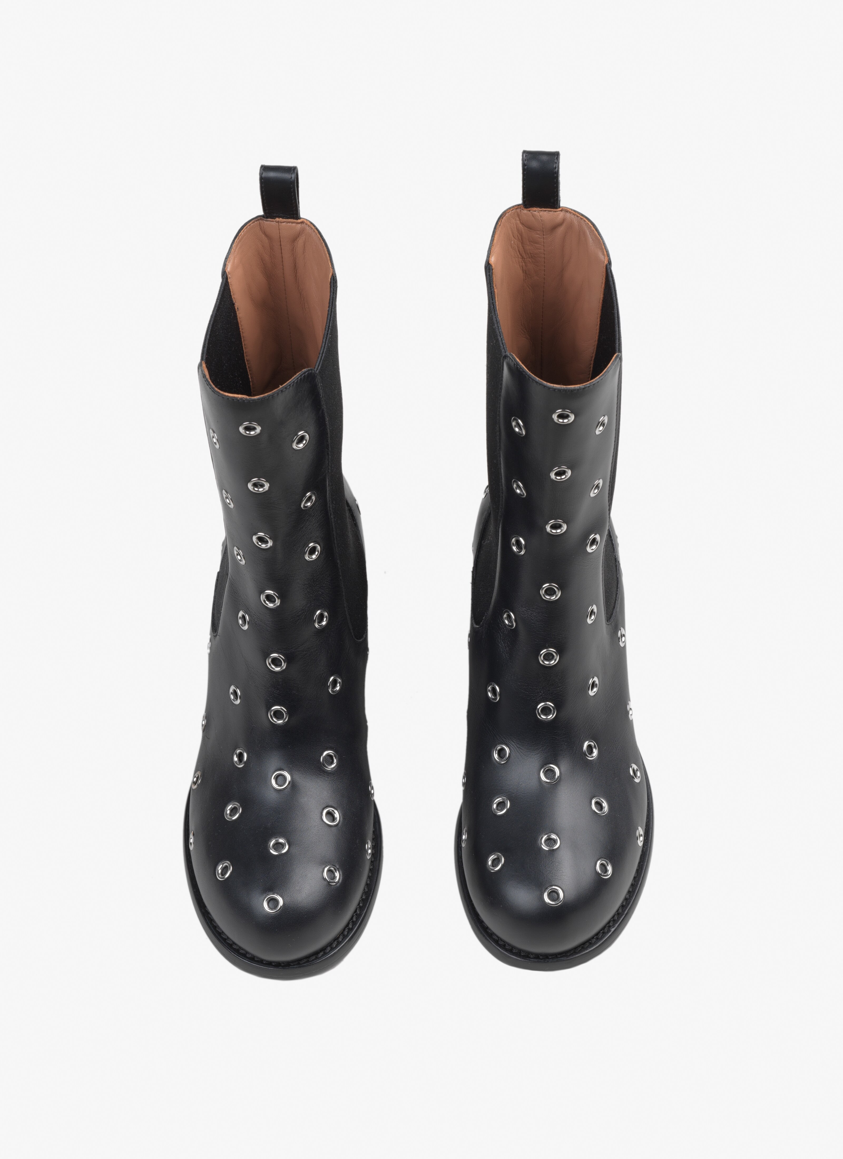 Round heeled boots
 - maison-alaia.com