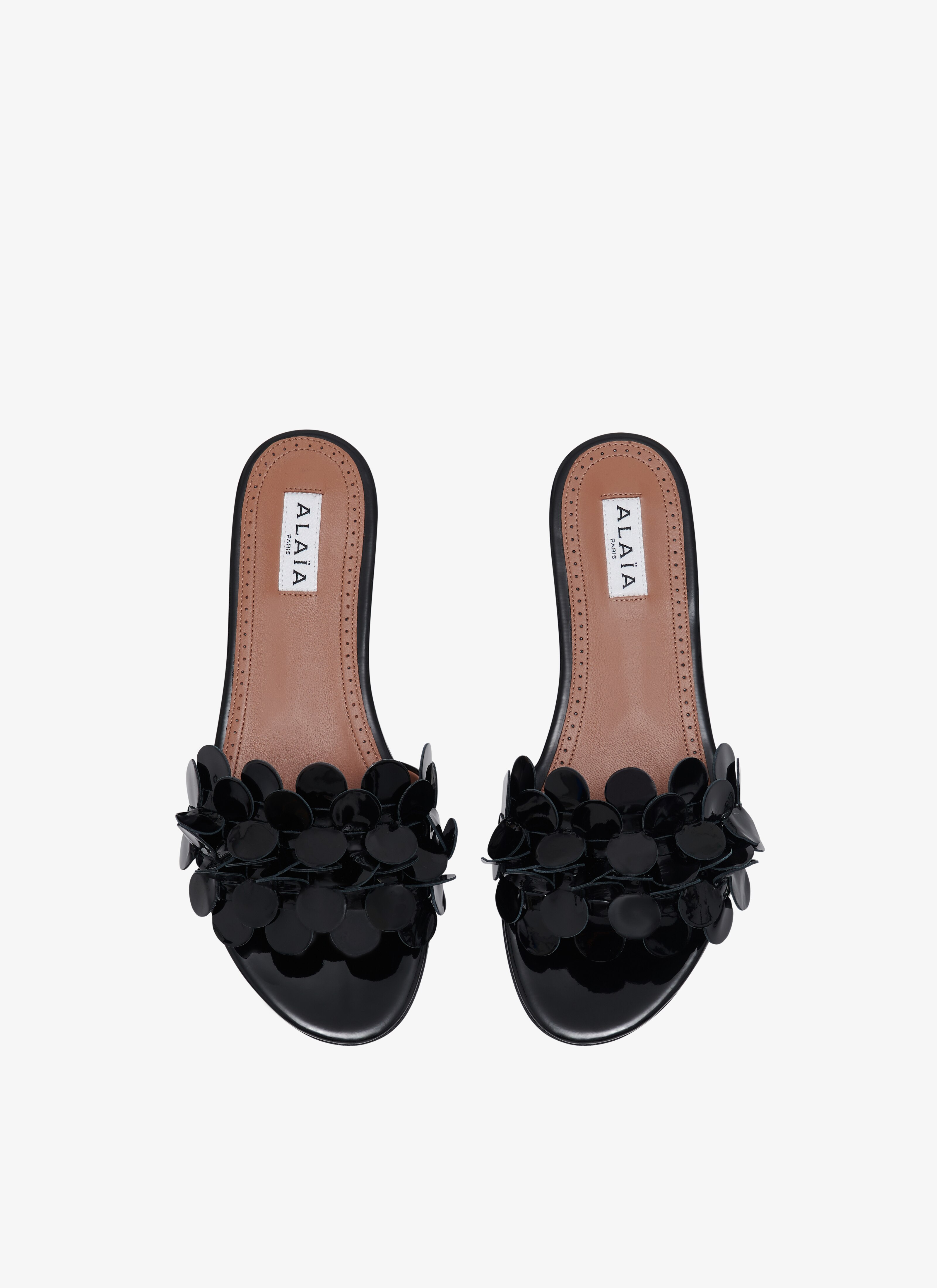 ALAÏA BLACK CONFETTIS MULES IN PATENT CALFSKIN