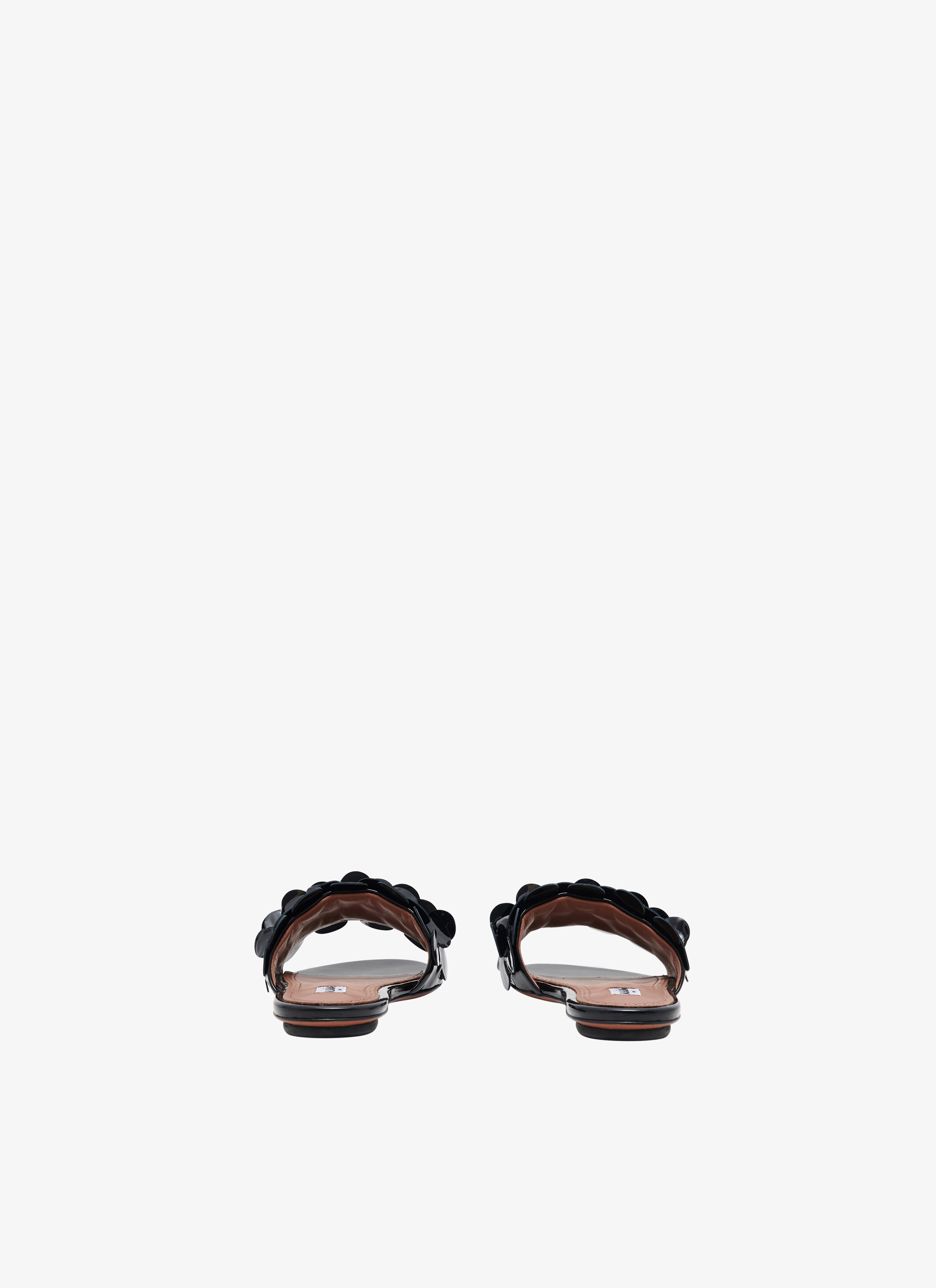 ALAÏA BLACK CONFETTIS MULES IN PATENT CALFSKIN