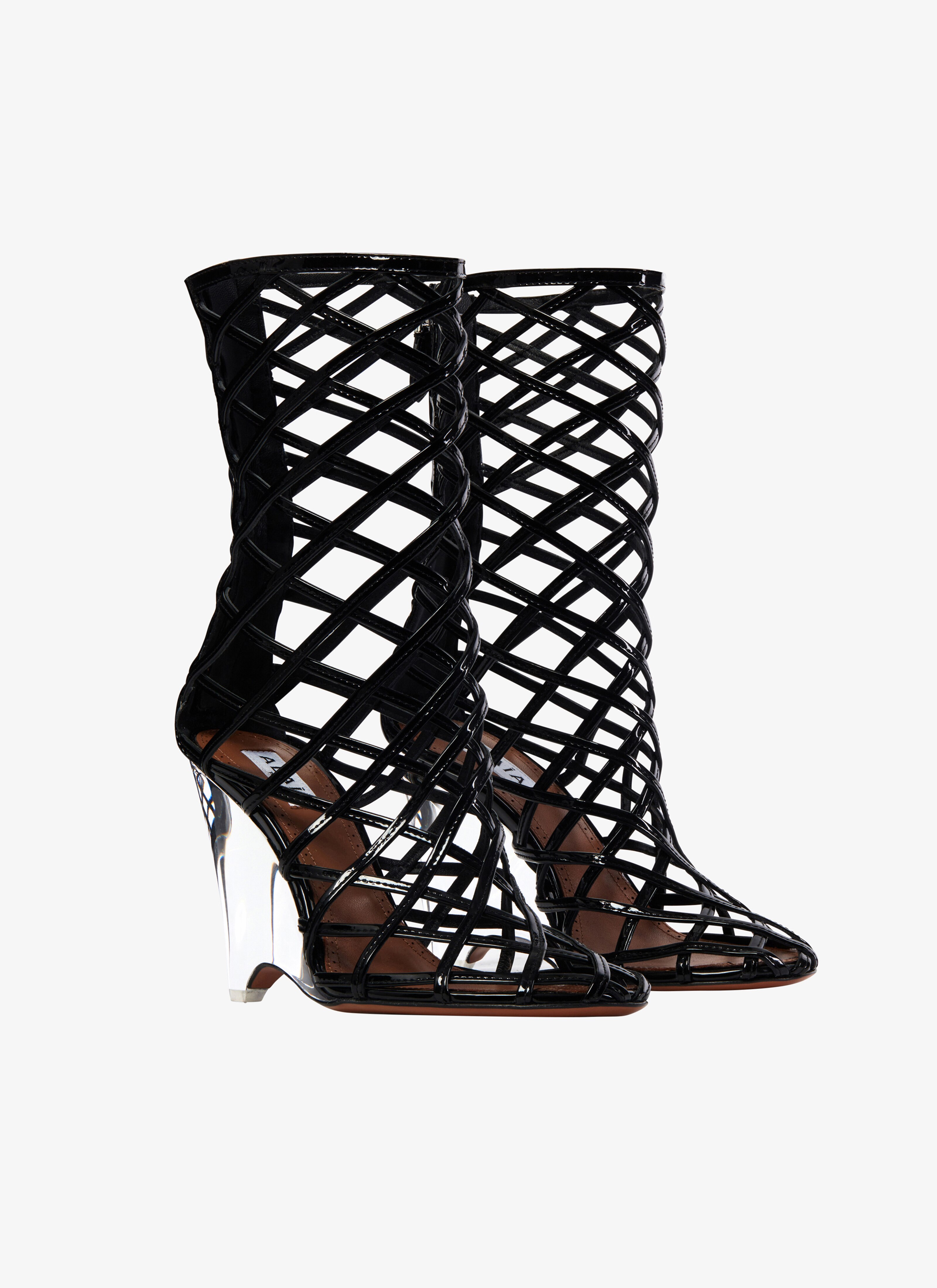 ALAÏA SCHWARZ BOOTIES LA CAGE MIT KEILABSATZ AUS LAMMLACKLEDER
