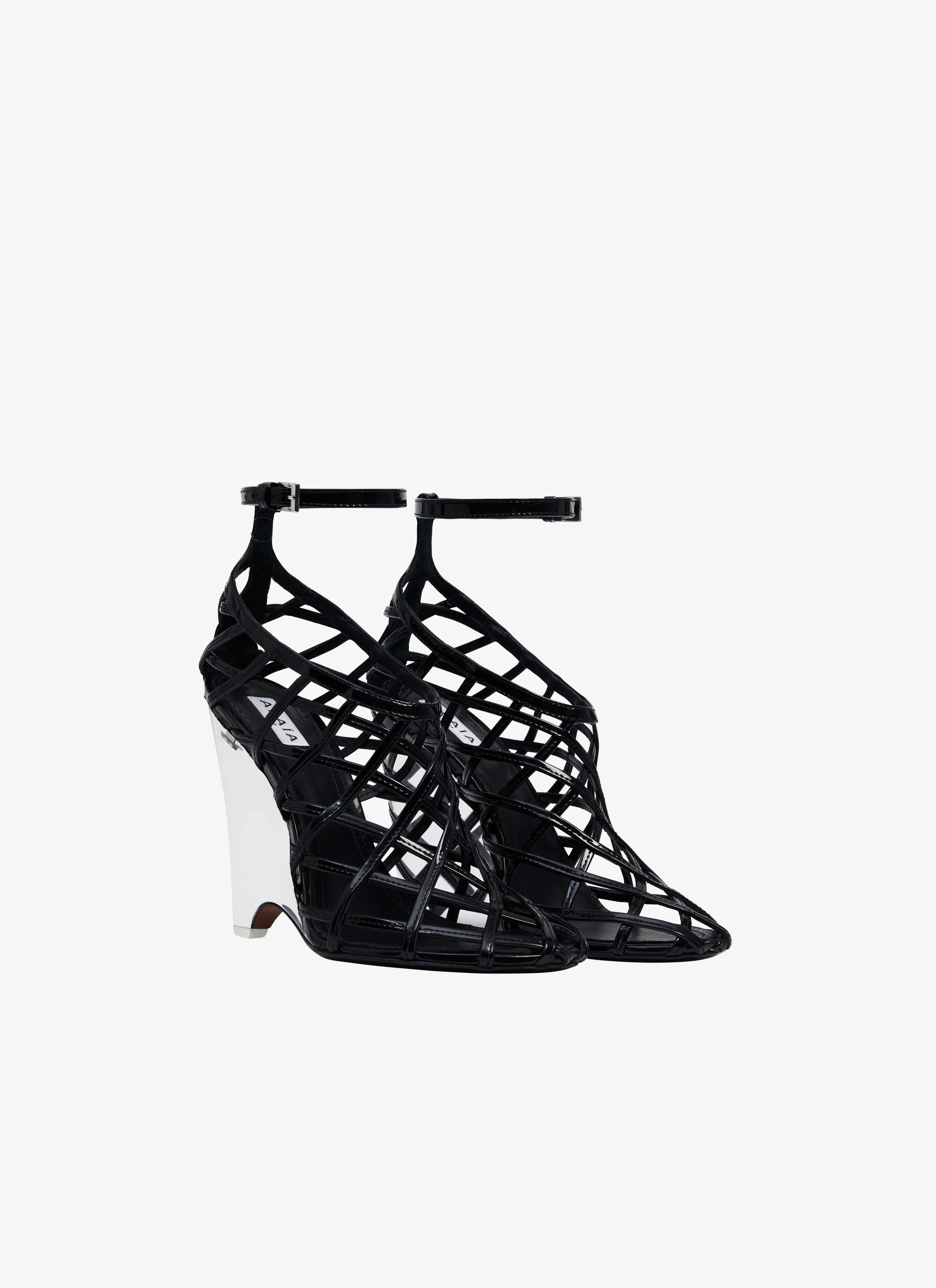 ALAÏA BLACK LA CAGE WEDGE PUMPS IN PATENT LAMBSKIN