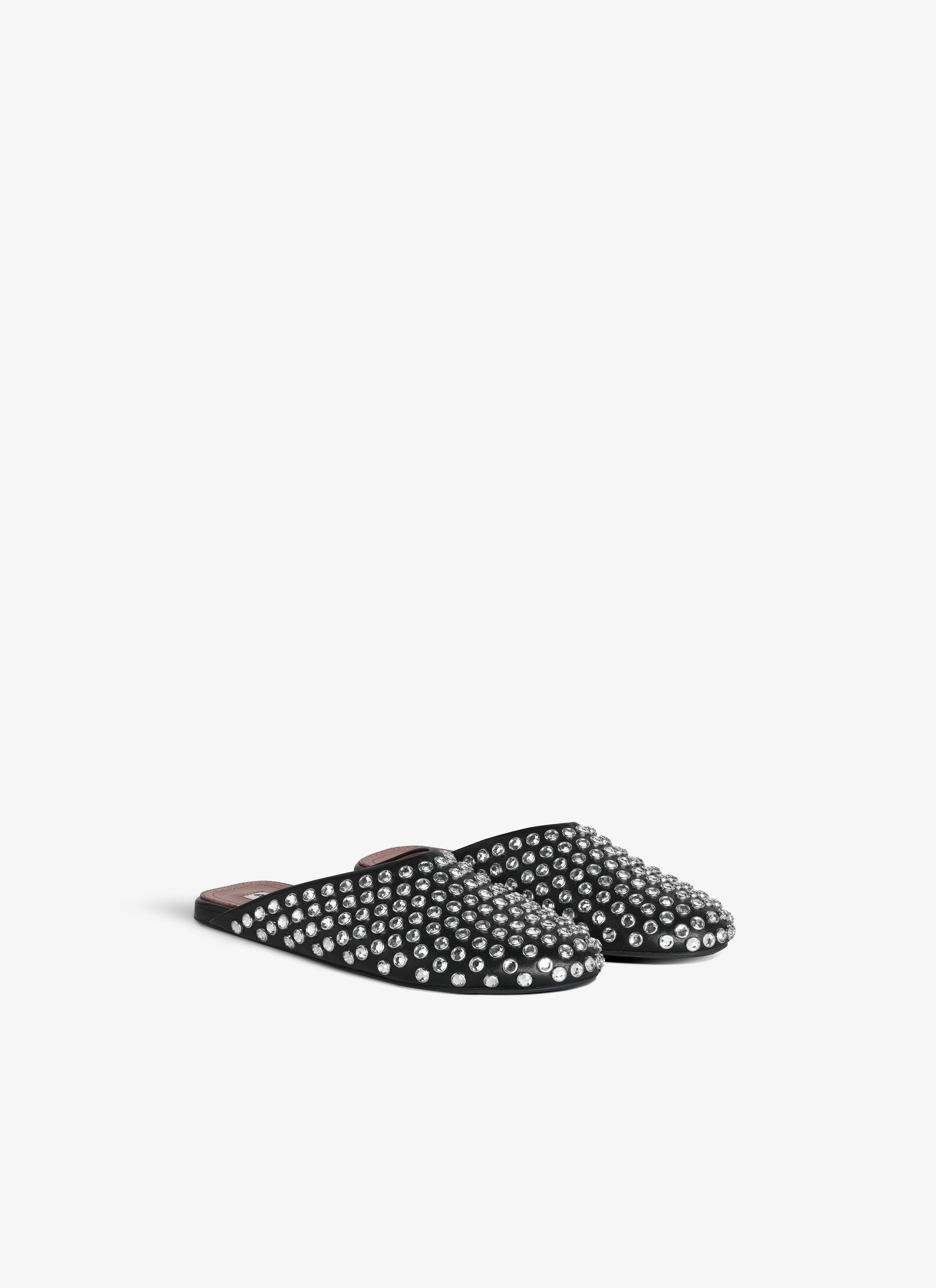 ALAÏA BLACK FLAT MULES IN STRASS LAMBSKIN