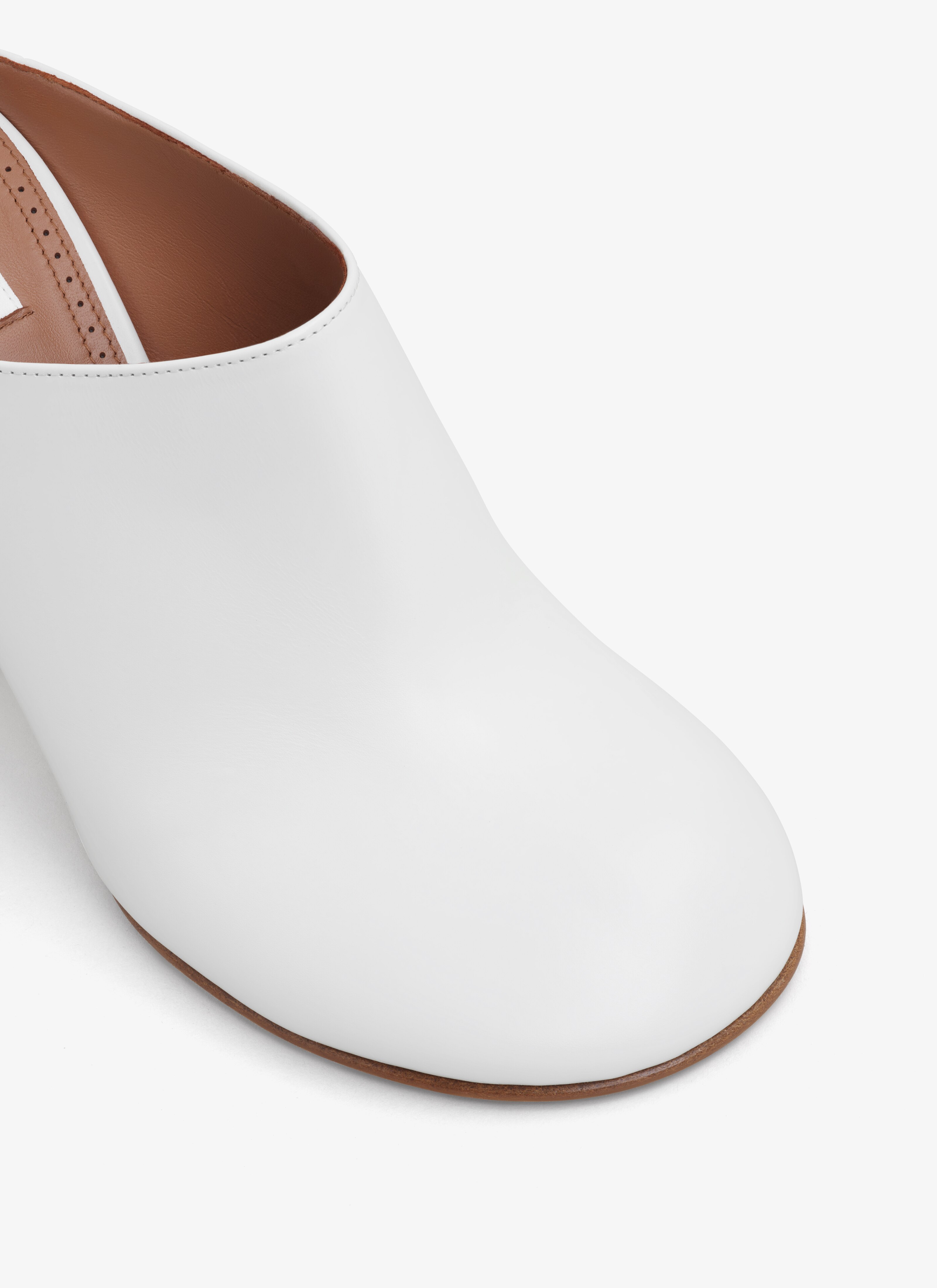 ALAÏA IVORY BABYLONE MULES IN CALFSKIN