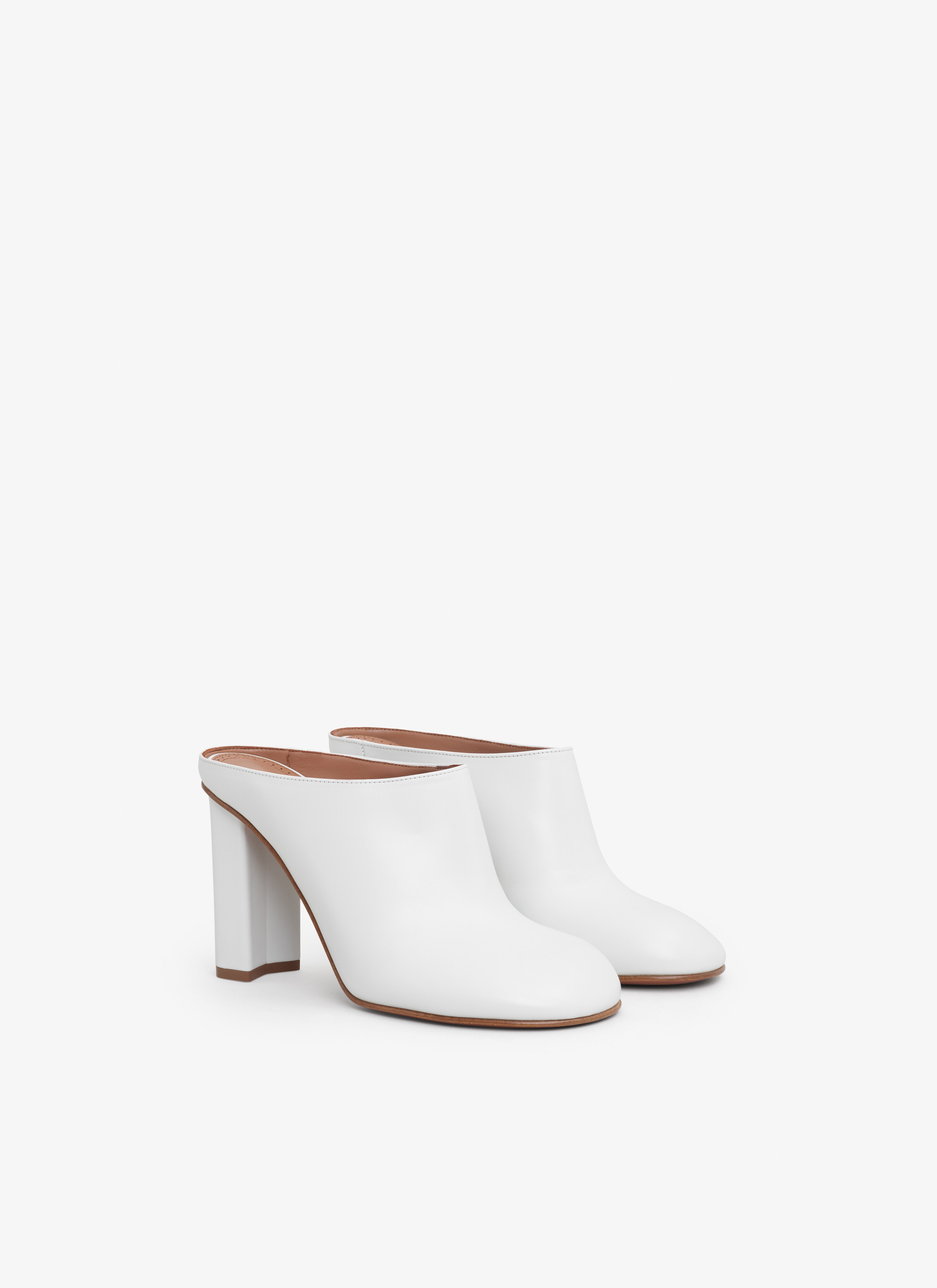 ALAÏA IVORY BABYLONE MULES IN CALFSKIN