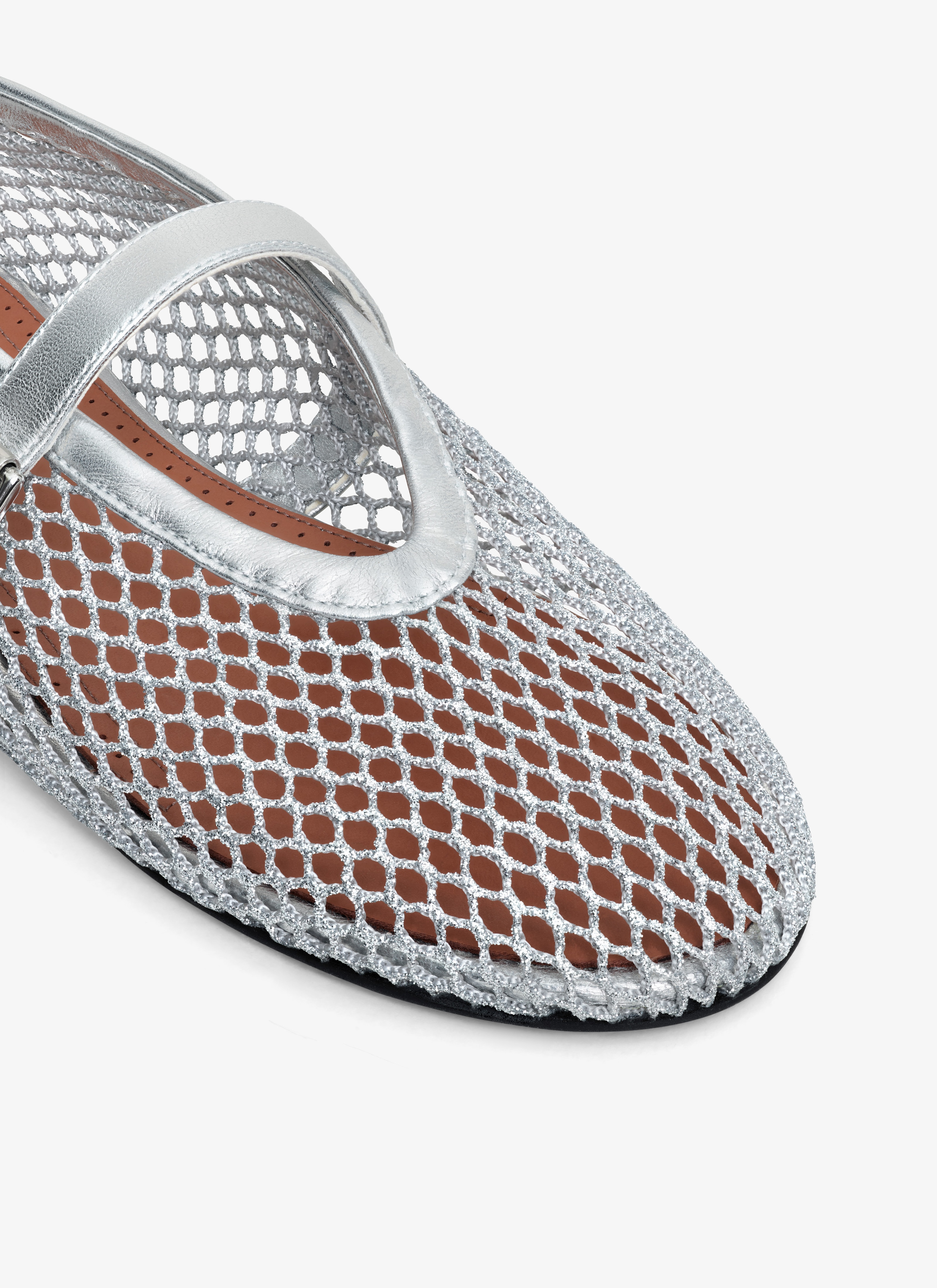 ALAÏA SILVER BALLET FLATS IN LAMINATED FISHNET