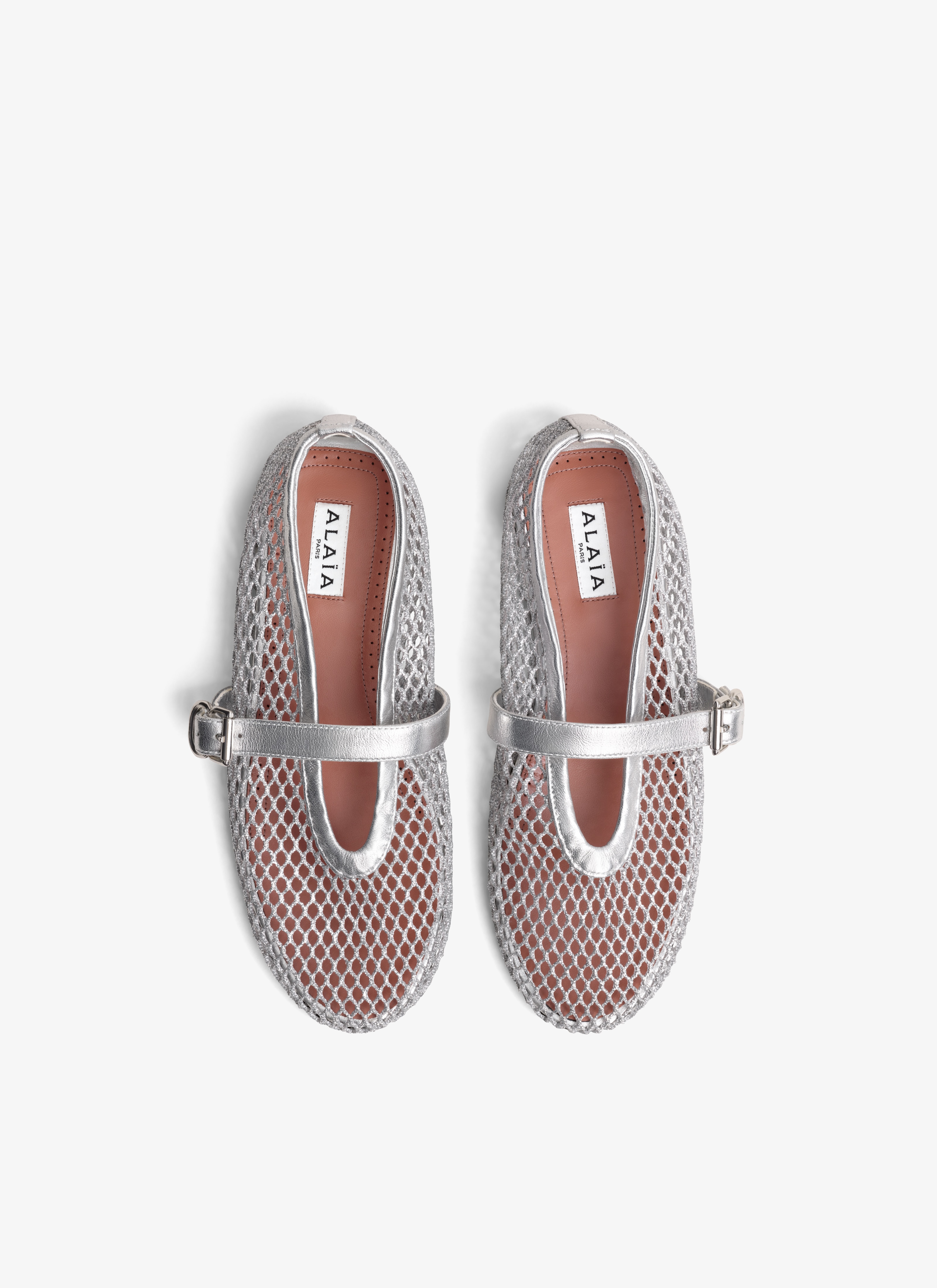 ALAÏA SILVER BALLET FLATS IN LAMINATED FISHNET