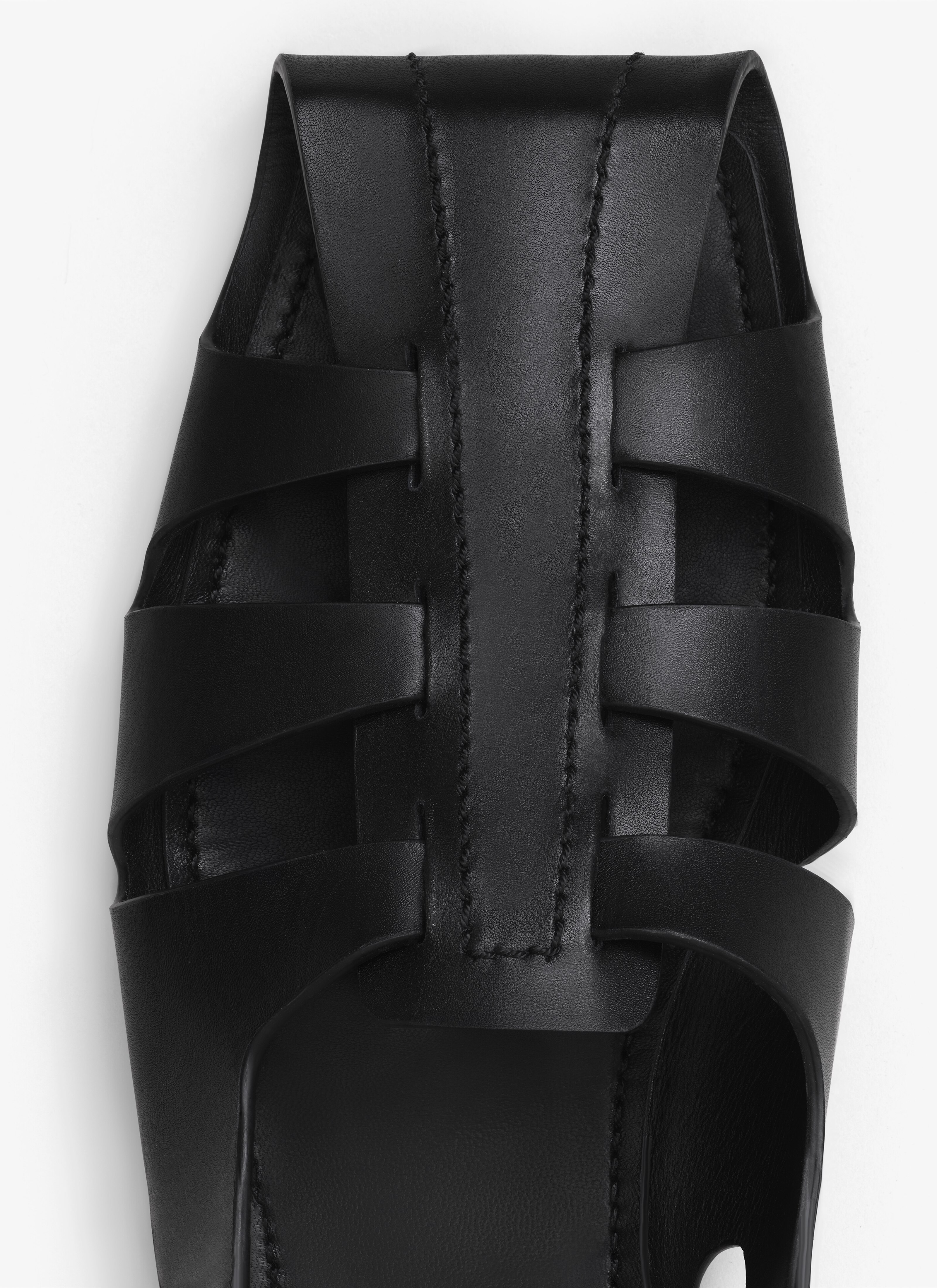 ALAÏA BLACK FOLDED FLAT SANDALS IN CALFSKIN