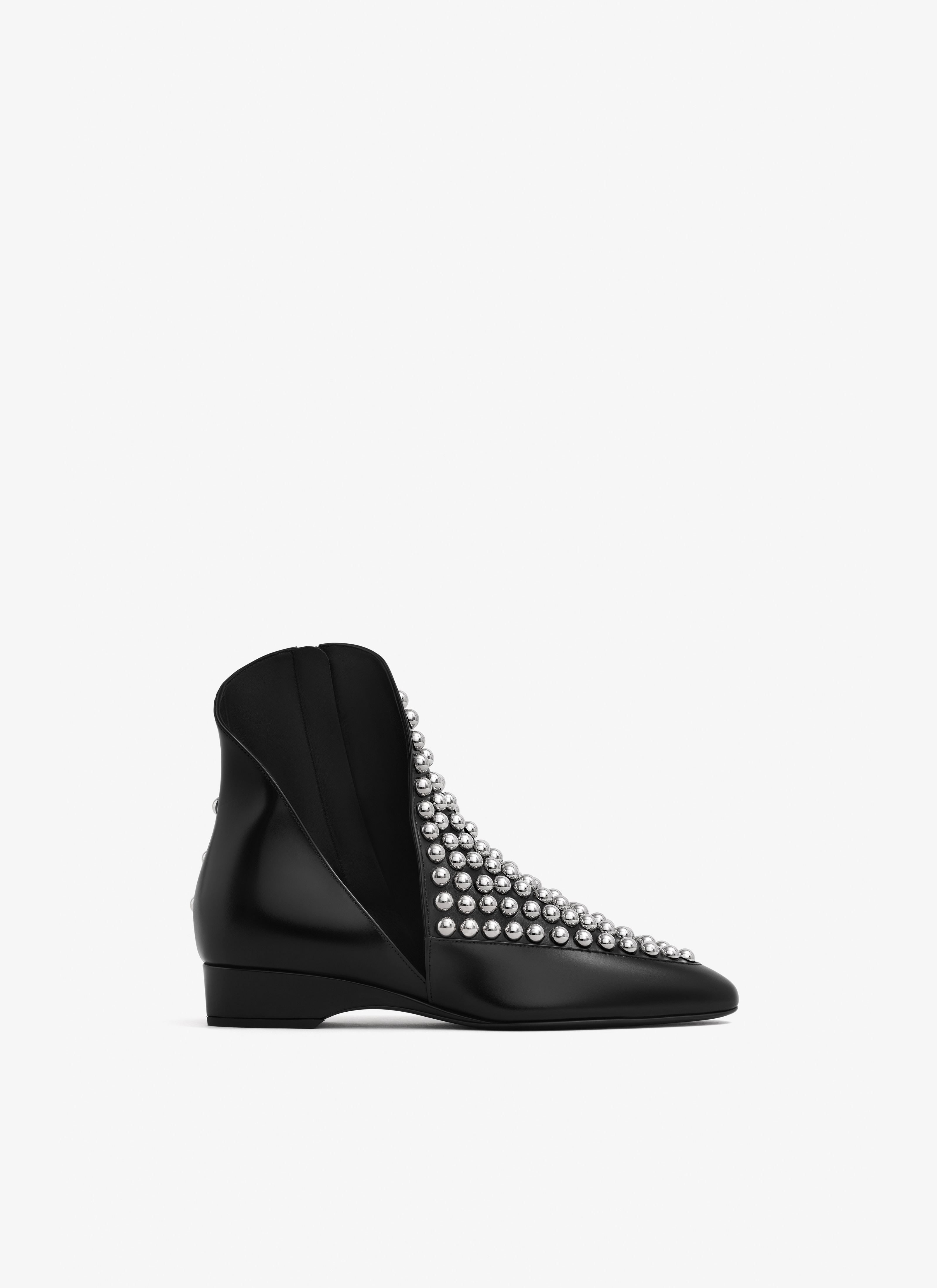 ALAÏA BLACK ASYMETRIC ANKLE BOOTS IN GLOSSY CALFSKIN WITH STUDS