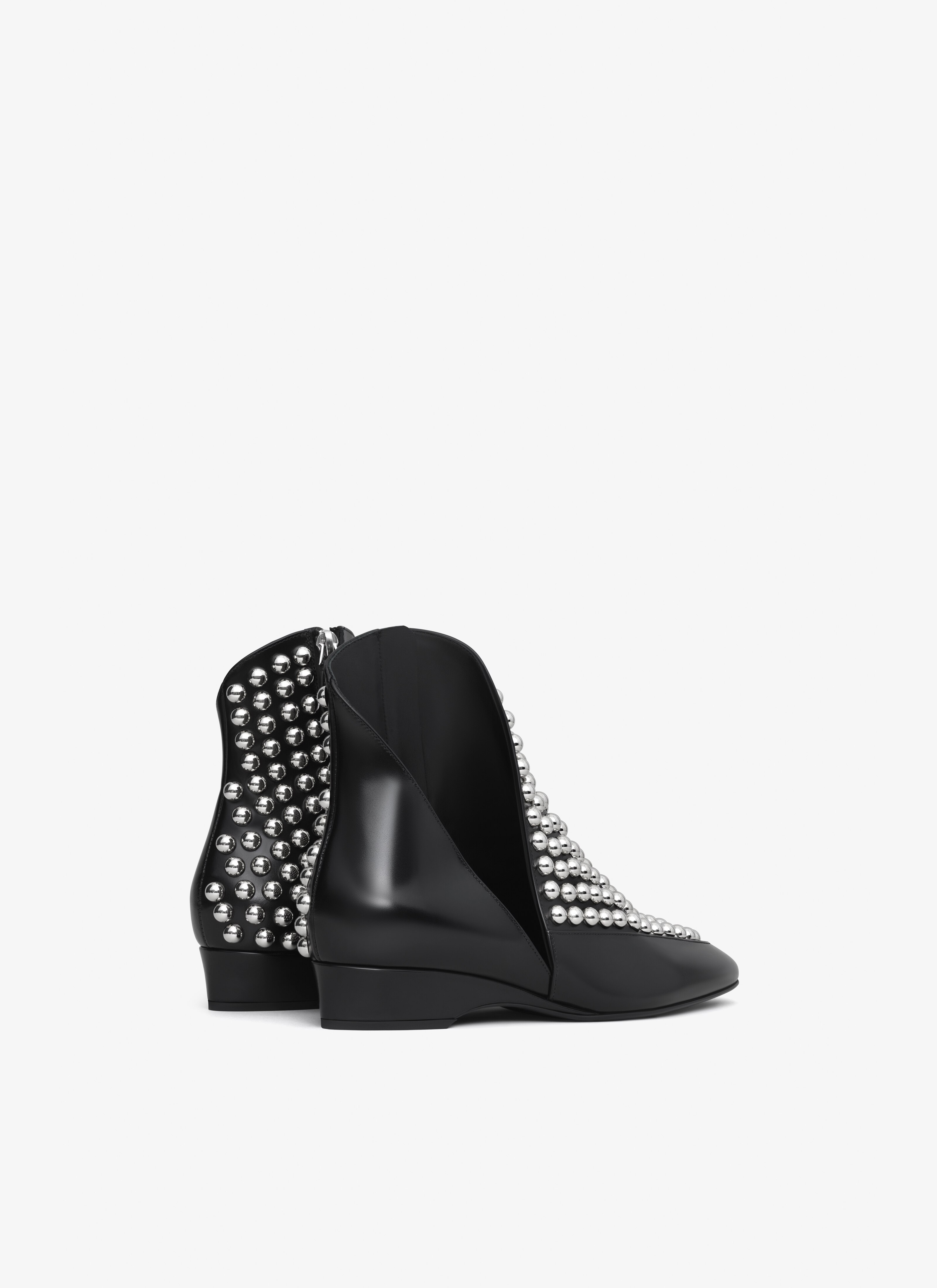 ALAÏA BLACK ASYMETRIC ANKLE BOOTS IN GLOSSY CALFSKIN WITH STUDS