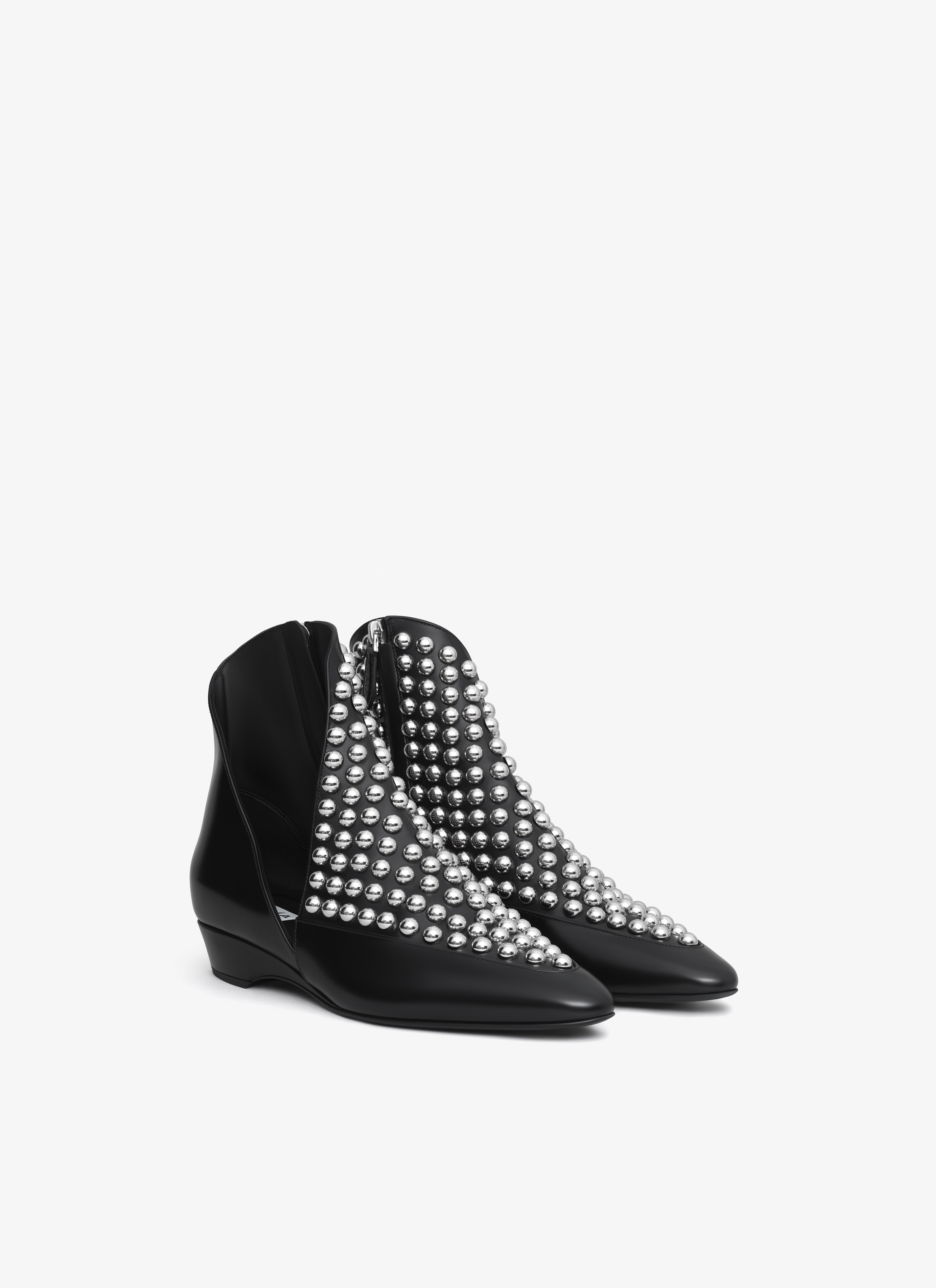 ALAÏA BLACK ASYMETRIC ANKLE BOOTS IN GLOSSY CALFSKIN WITH STUDS
