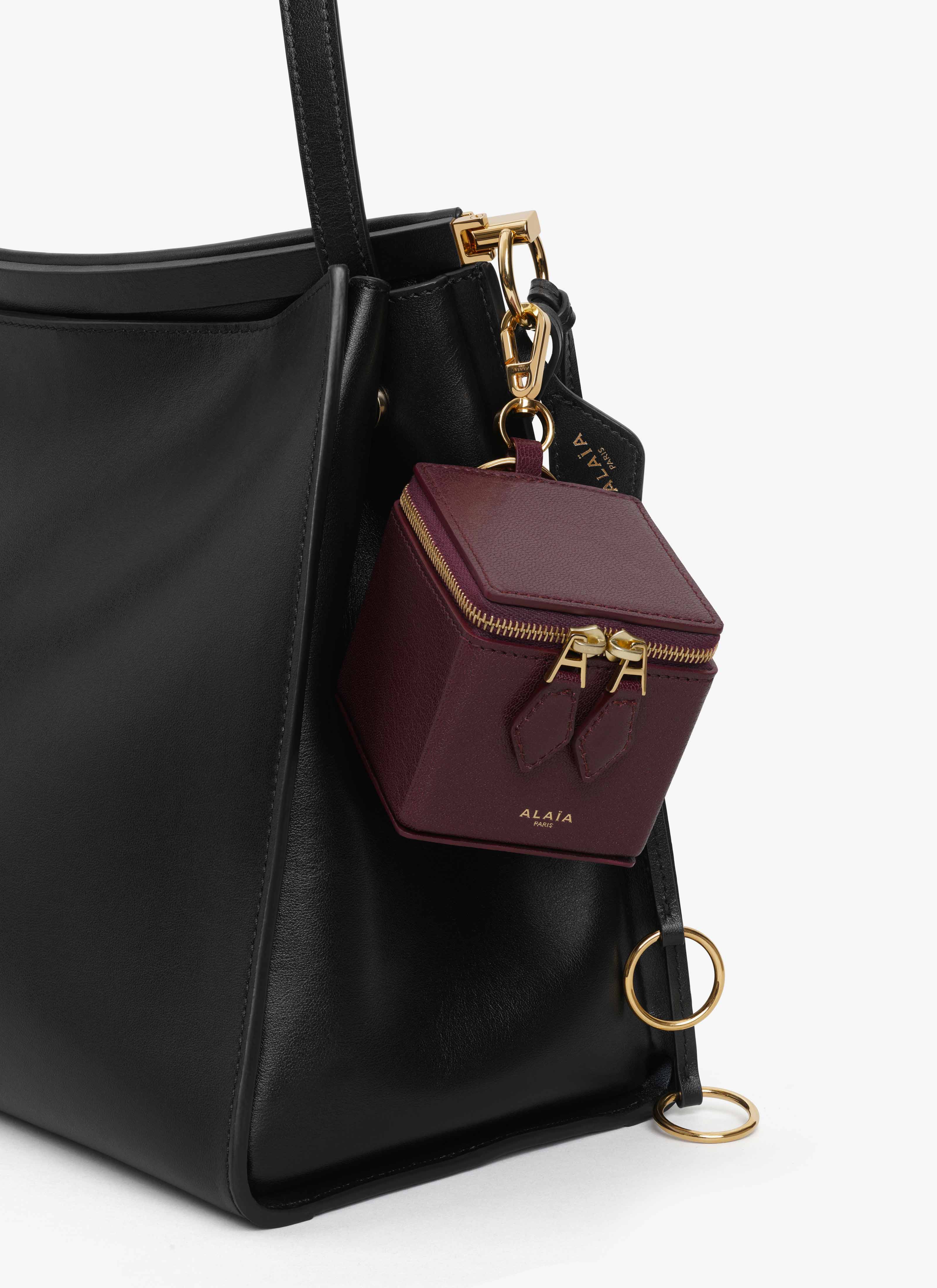ALAÏA DARK RED SQUARE COIN PURSE IN GOATSKIN