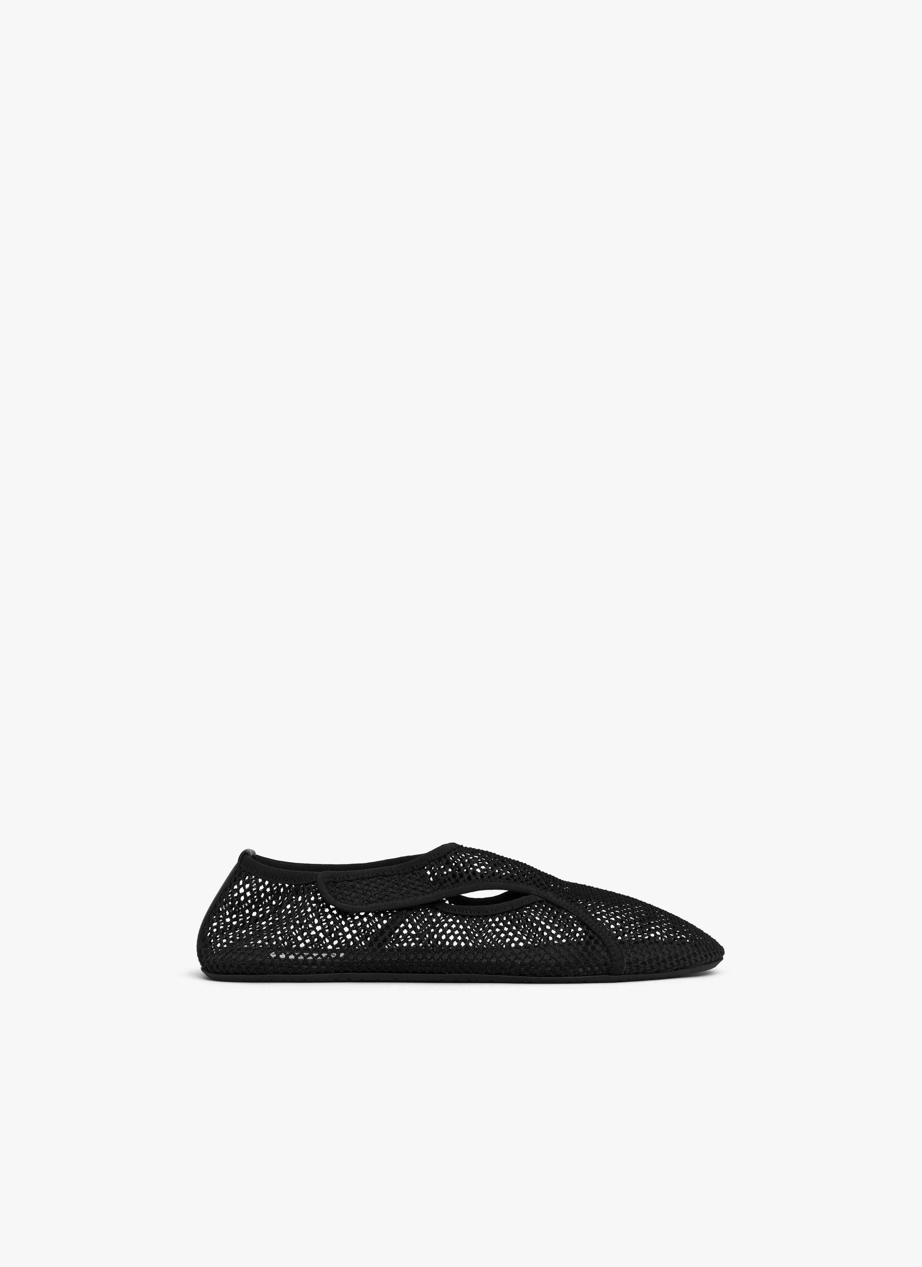 ALAÏA BLACK SLIPPERS IN FISHNET