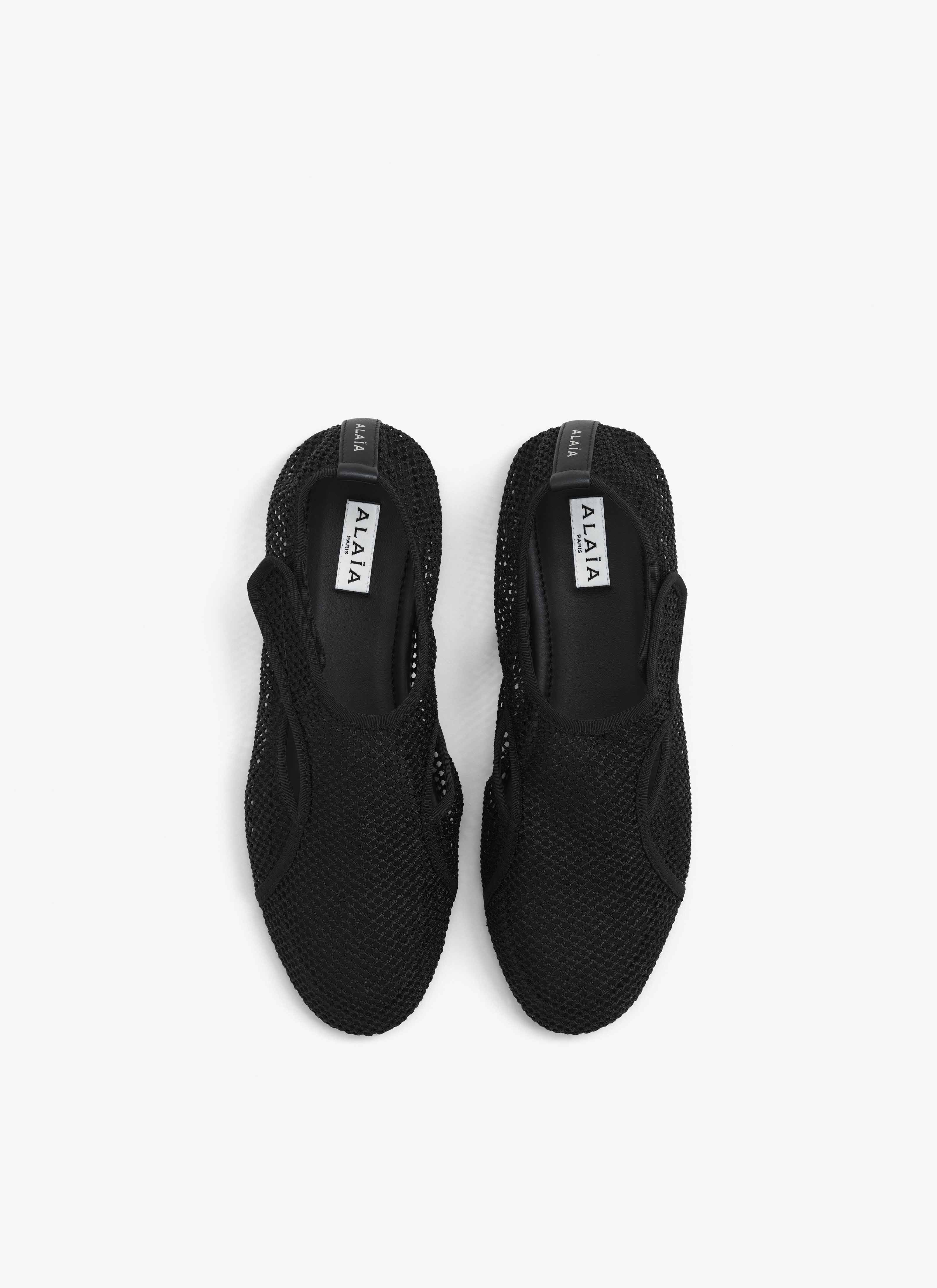 ALAÏA BLACK SLIPPERS IN FISHNET