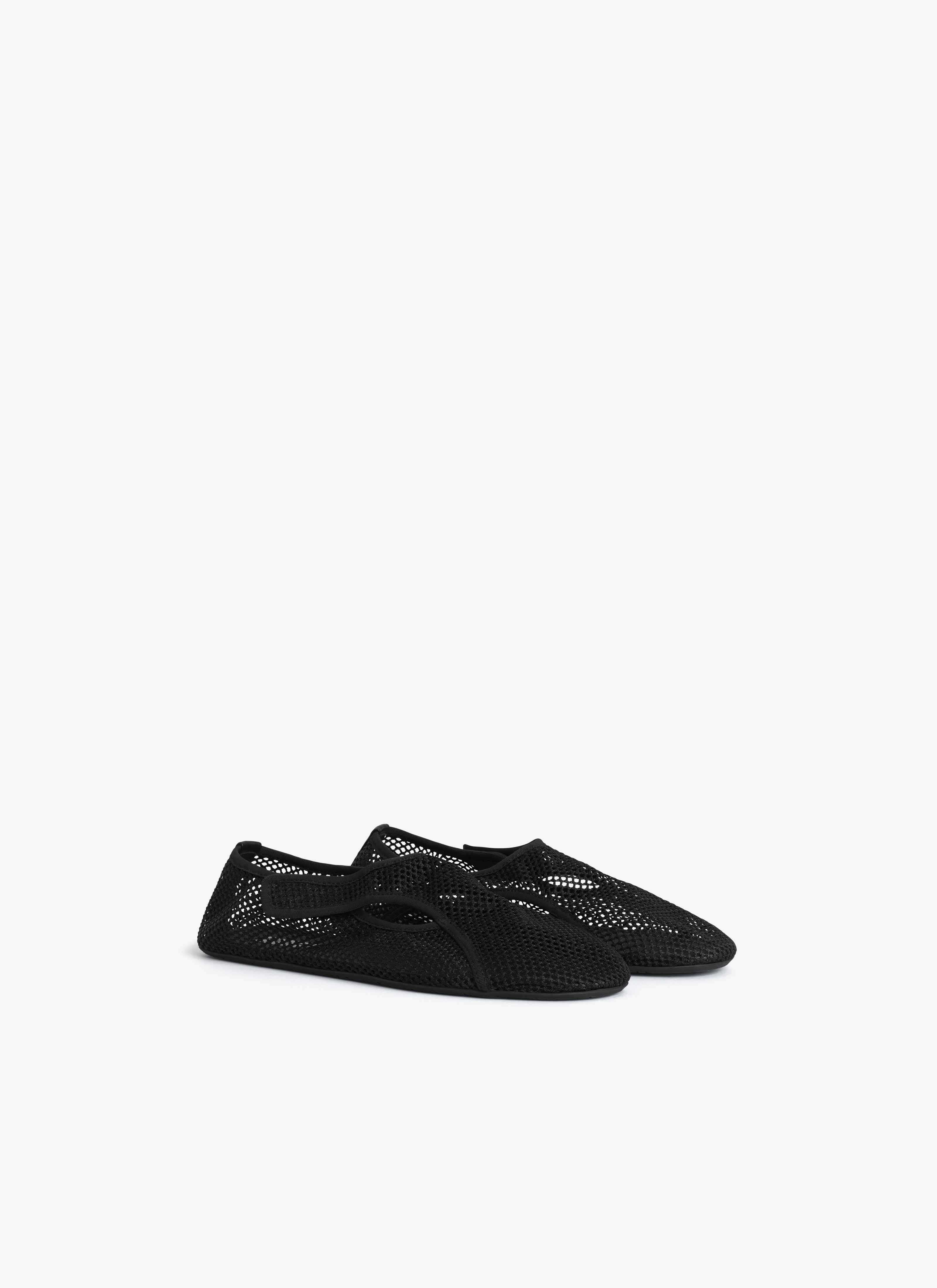 ALAÏA BLACK SLIPPERS IN FISHNET