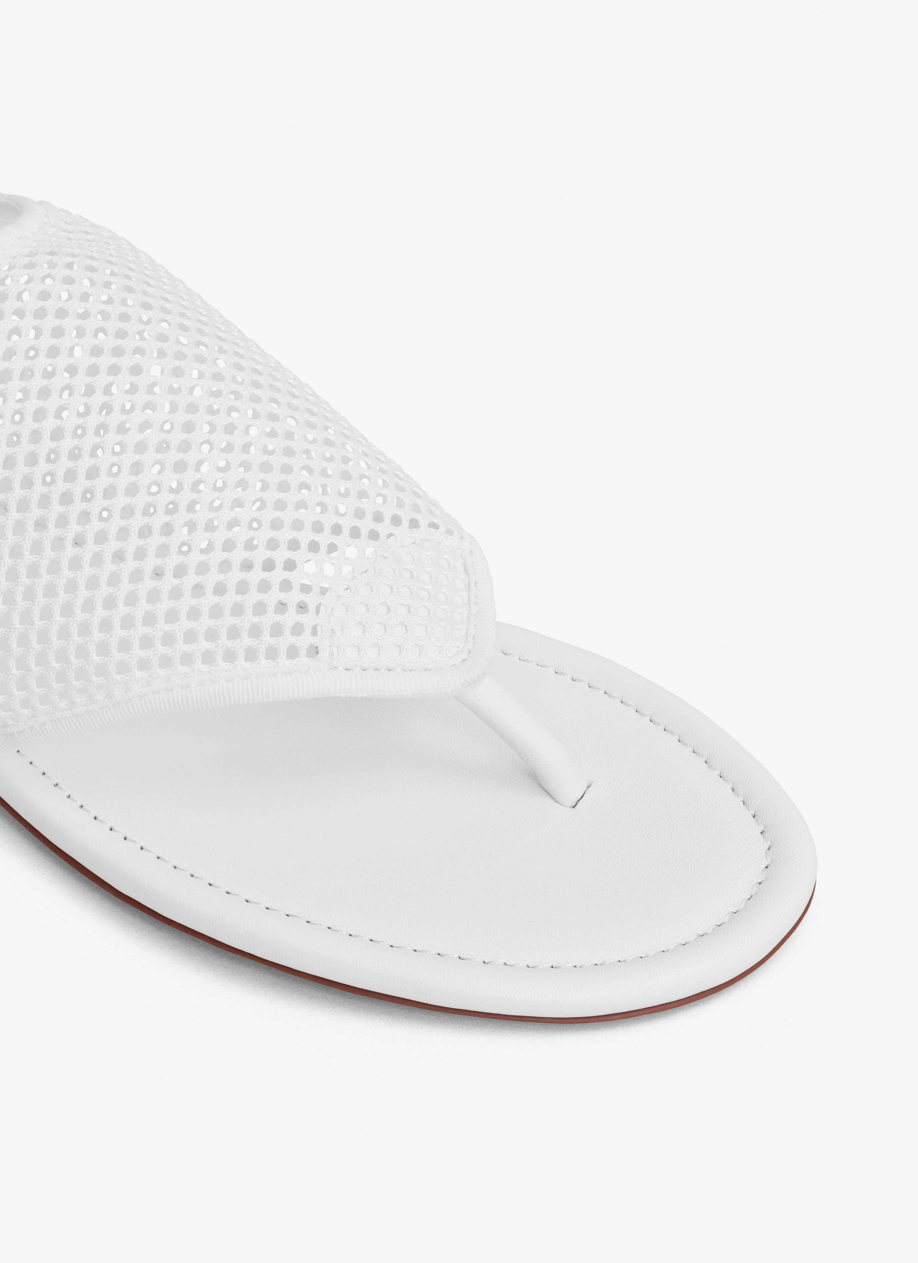 ALAÏA OPTIC WHITE THONG SANDALS IN FISHNET