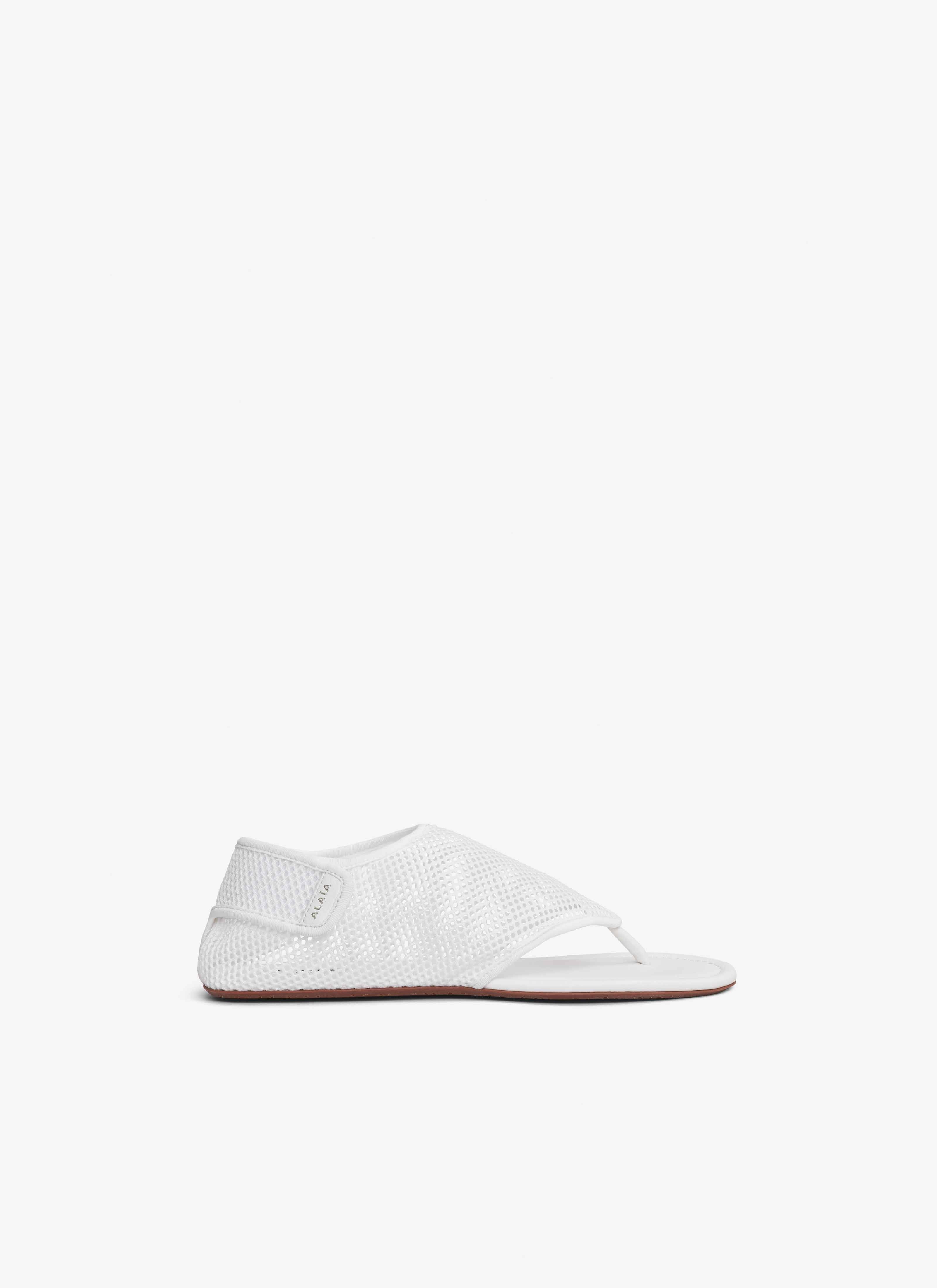 ALAÏA OPTIC WHITE THONG SANDALS IN FISHNET