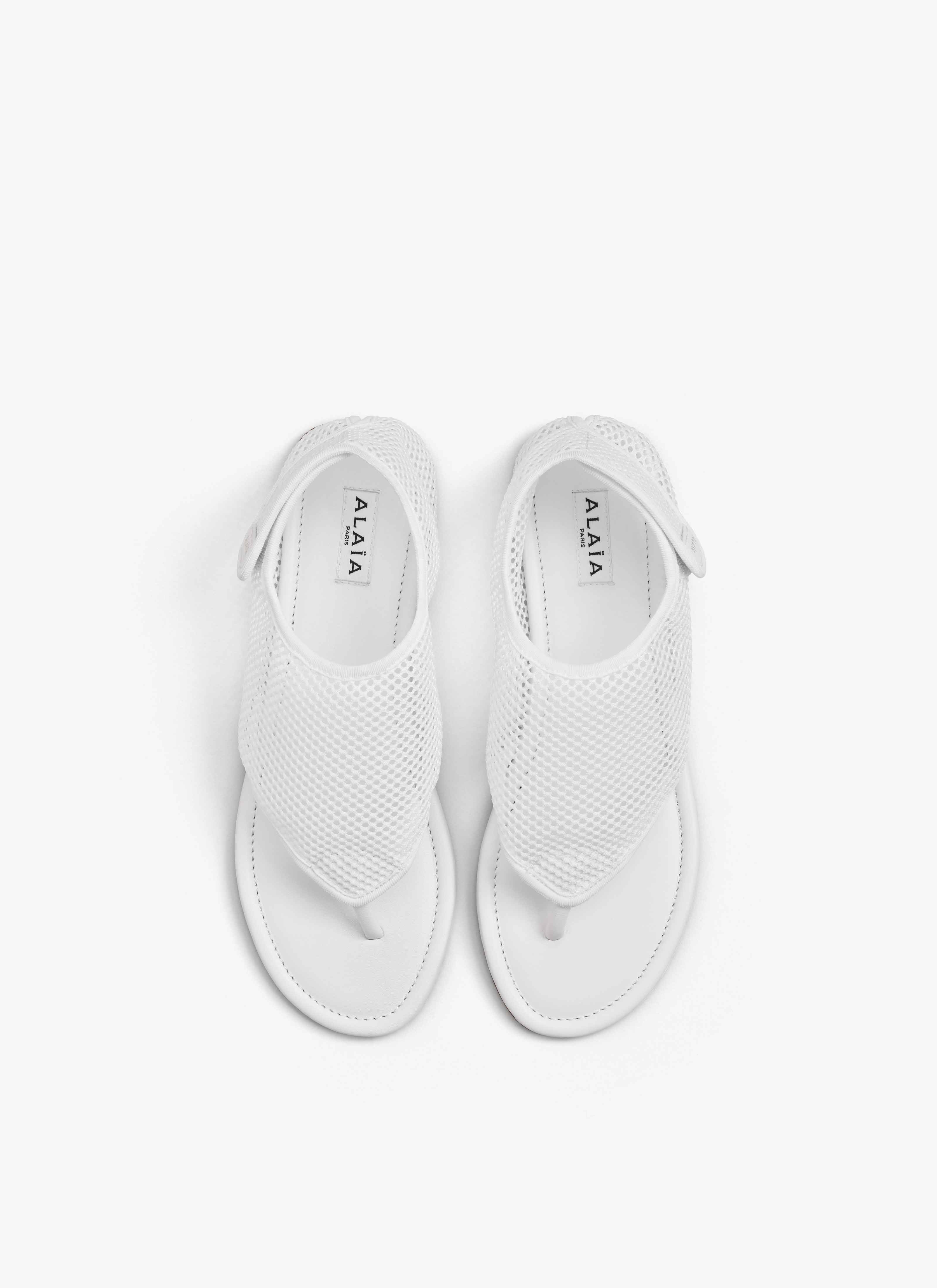 ALAÏA OPTIC WHITE THONG SANDALS IN FISHNET