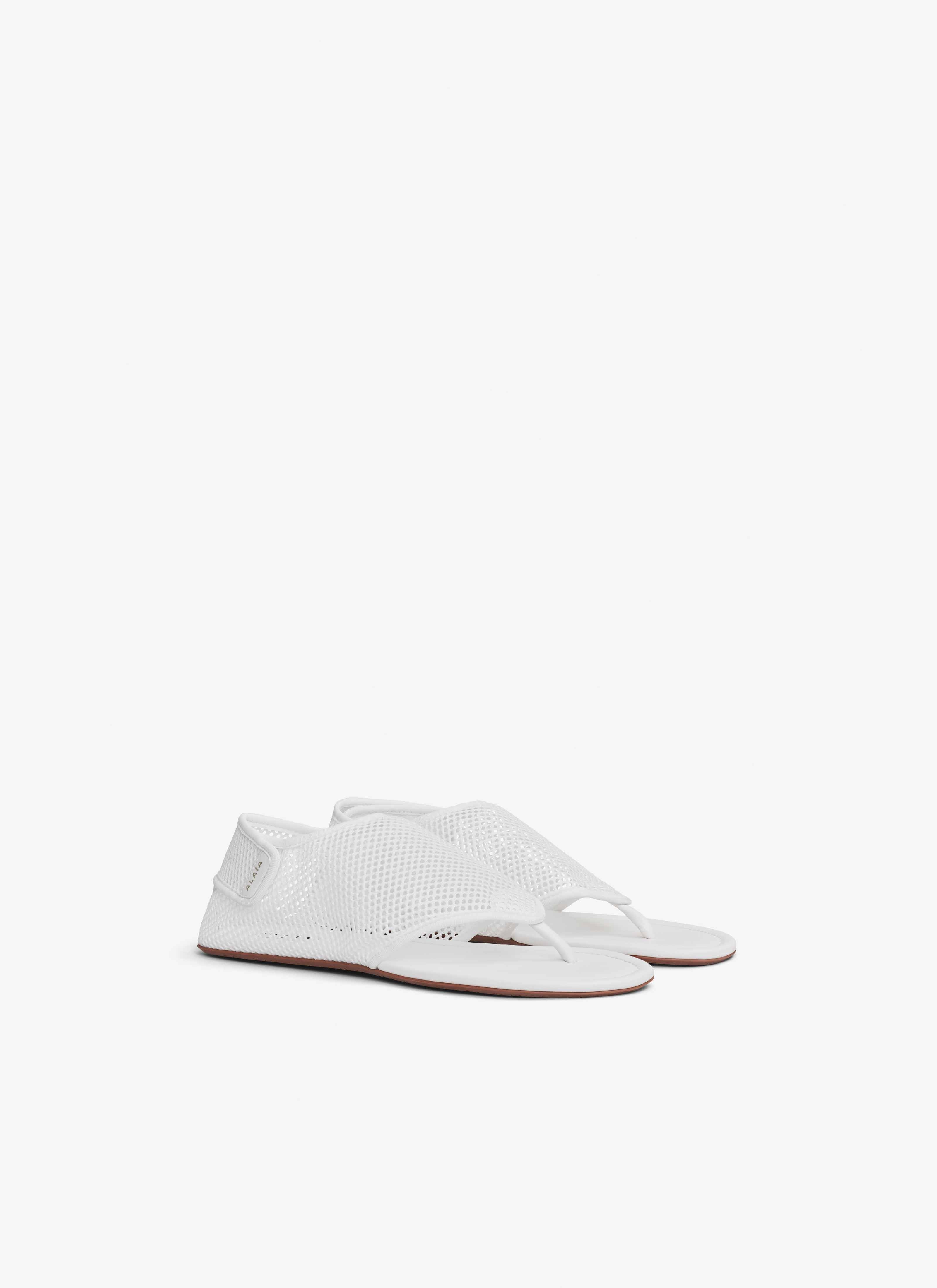 ALAÏA OPTIC WHITE THONG SANDALS IN FISHNET