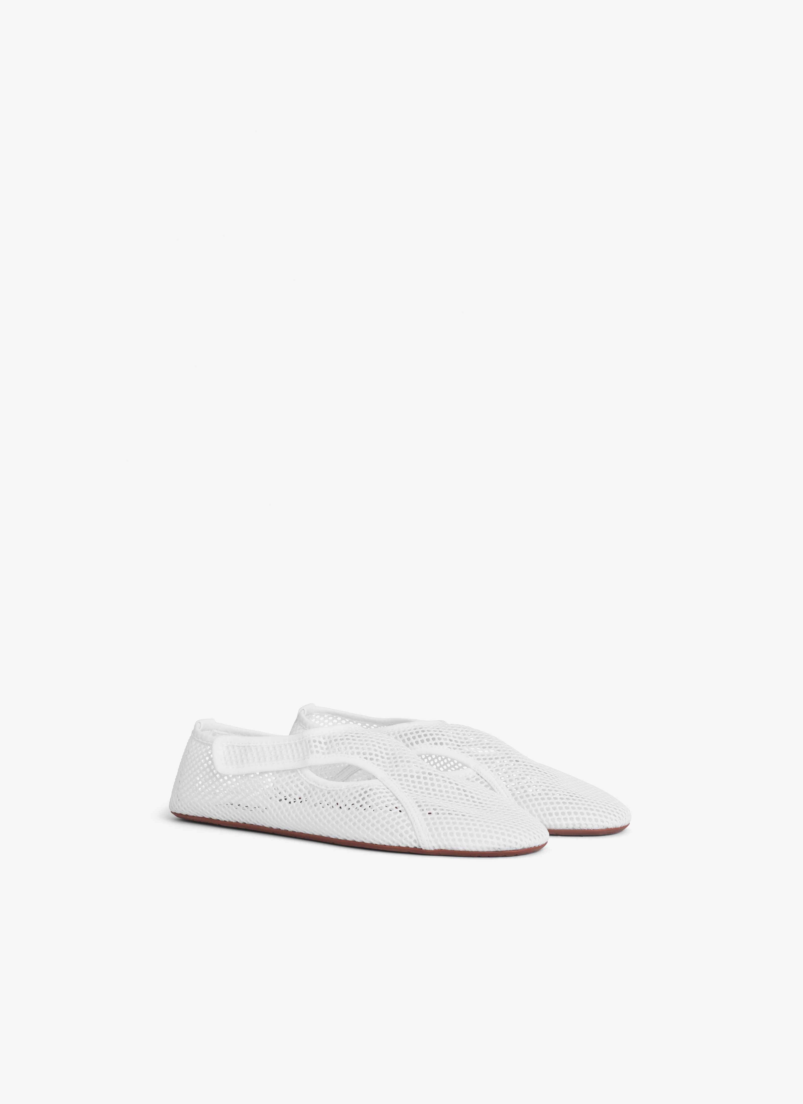 ALAÏA OPTIC WHITE SLIPPERS IN FISHNET