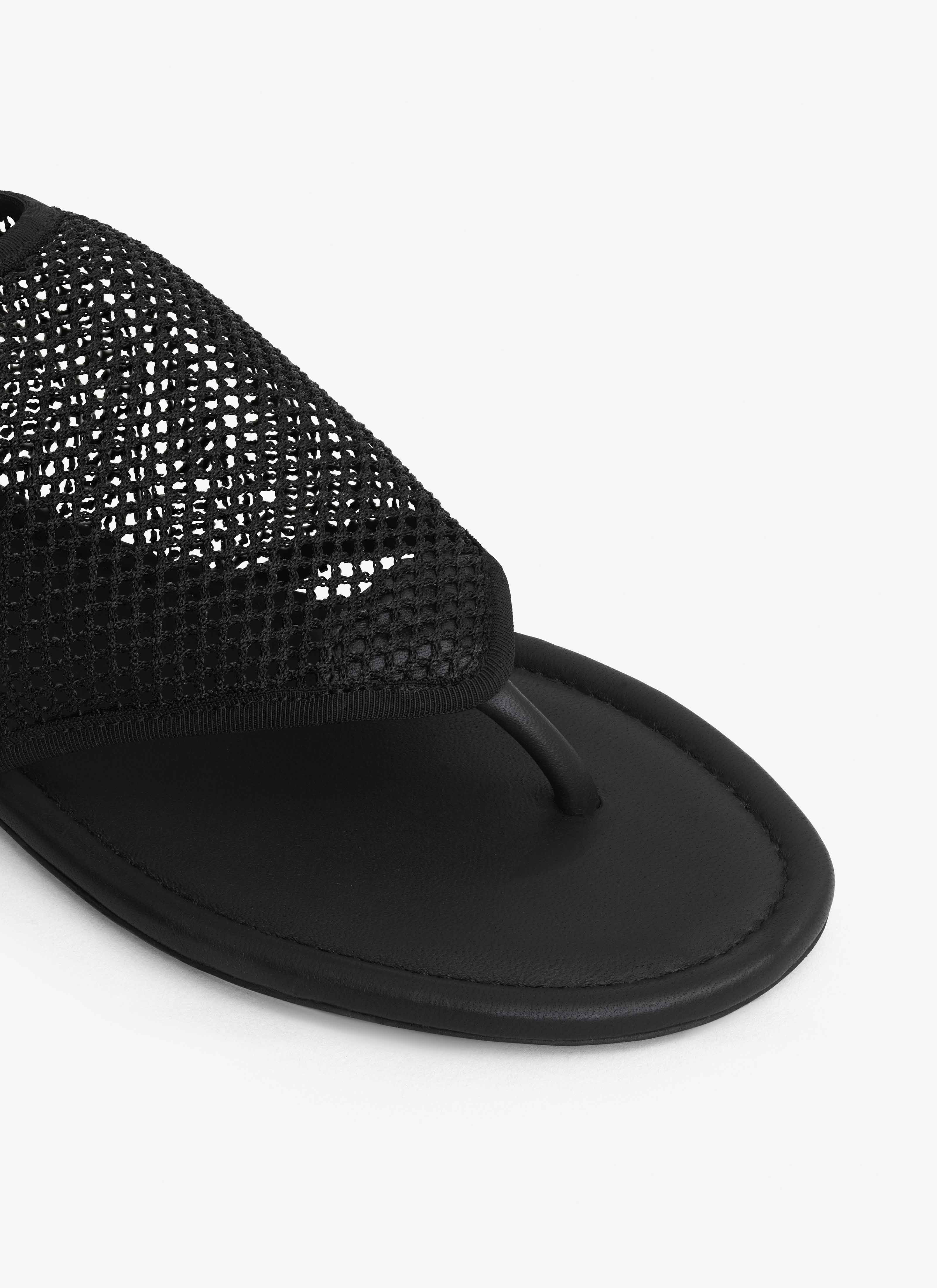 ALAÏA BLACK THONG SANDALS IN FISHNET