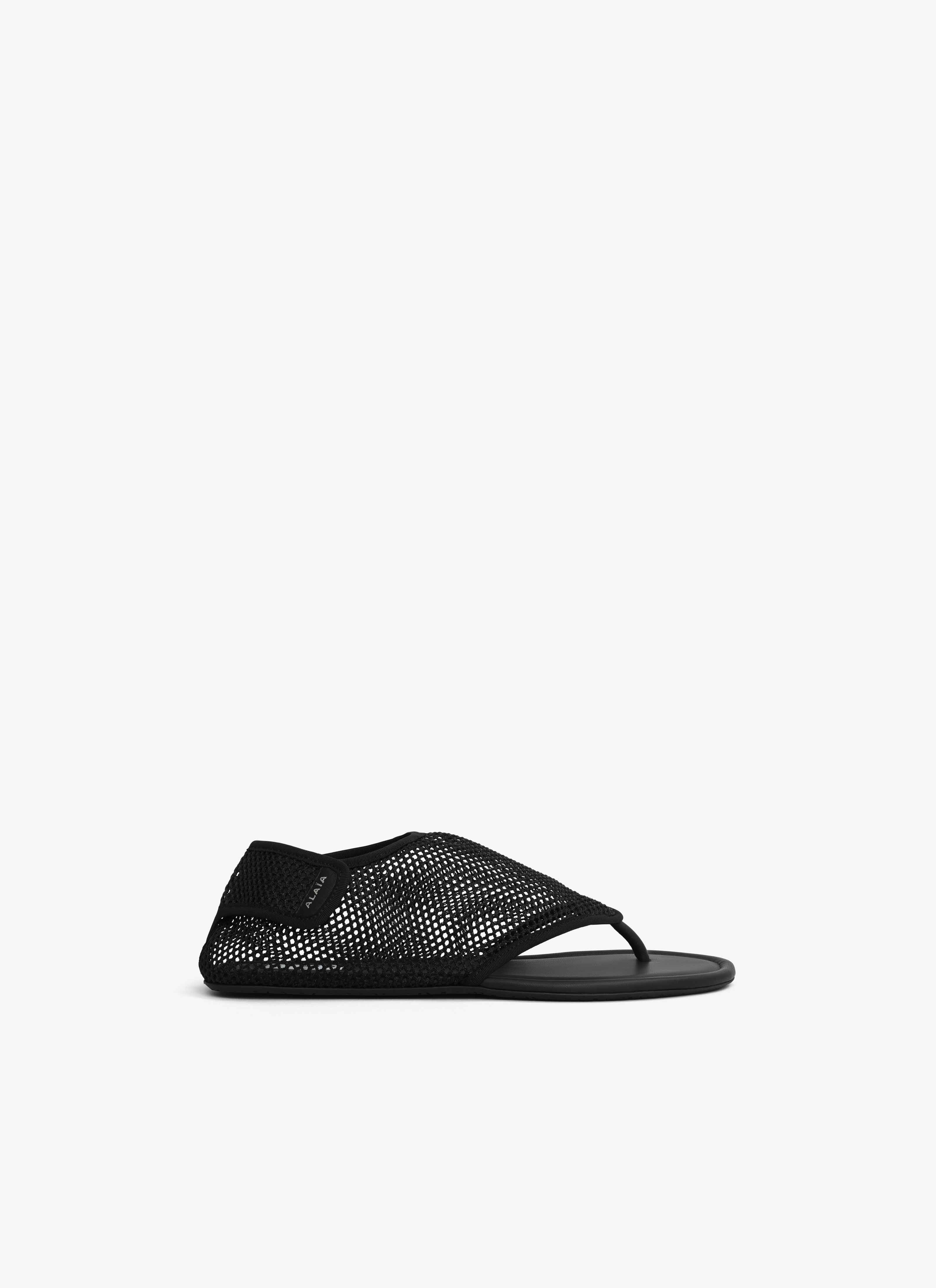 ALAÏA BLACK THONG SANDALS IN FISHNET