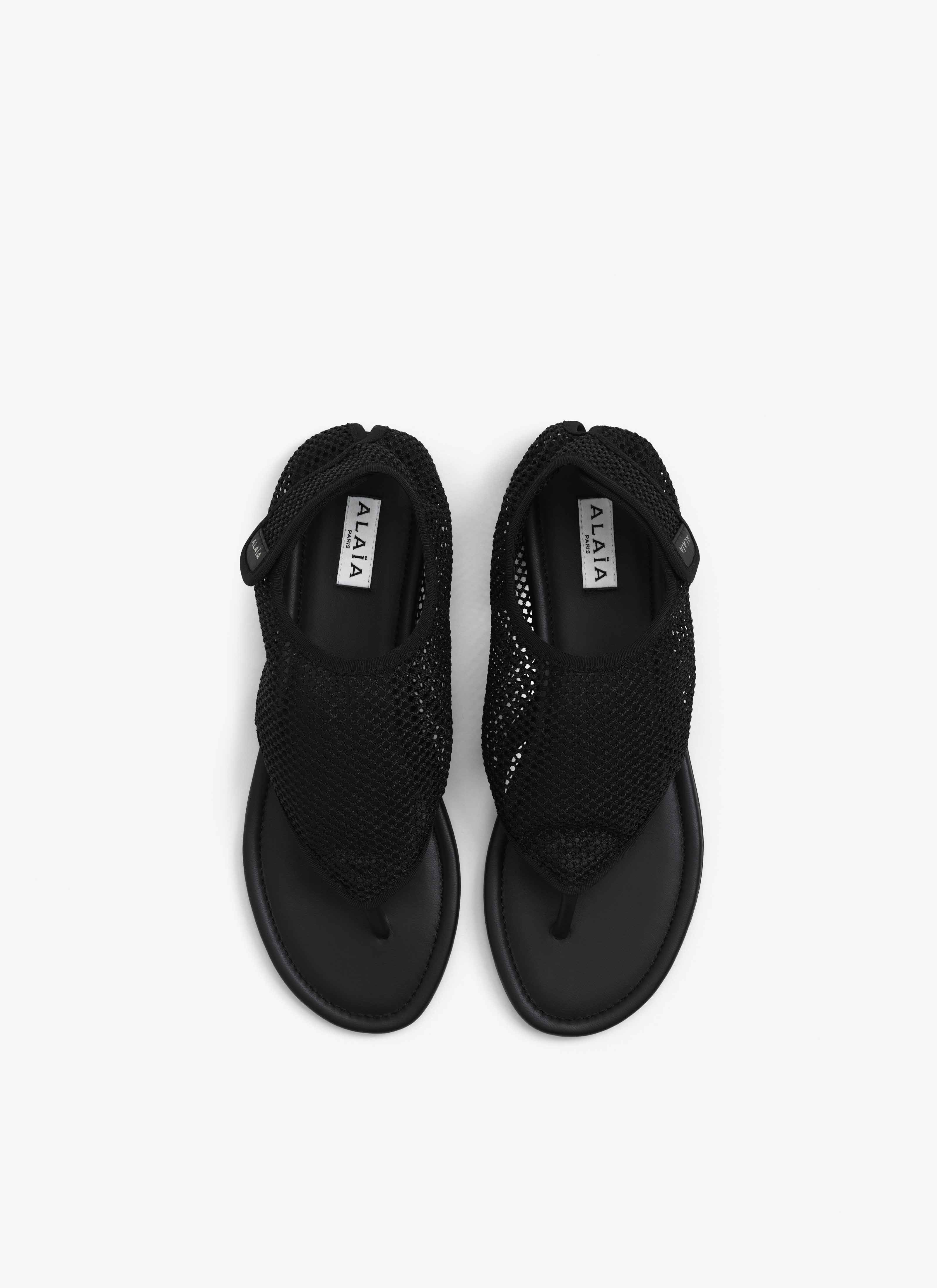 ALAÏA BLACK THONG SANDALS IN FISHNET