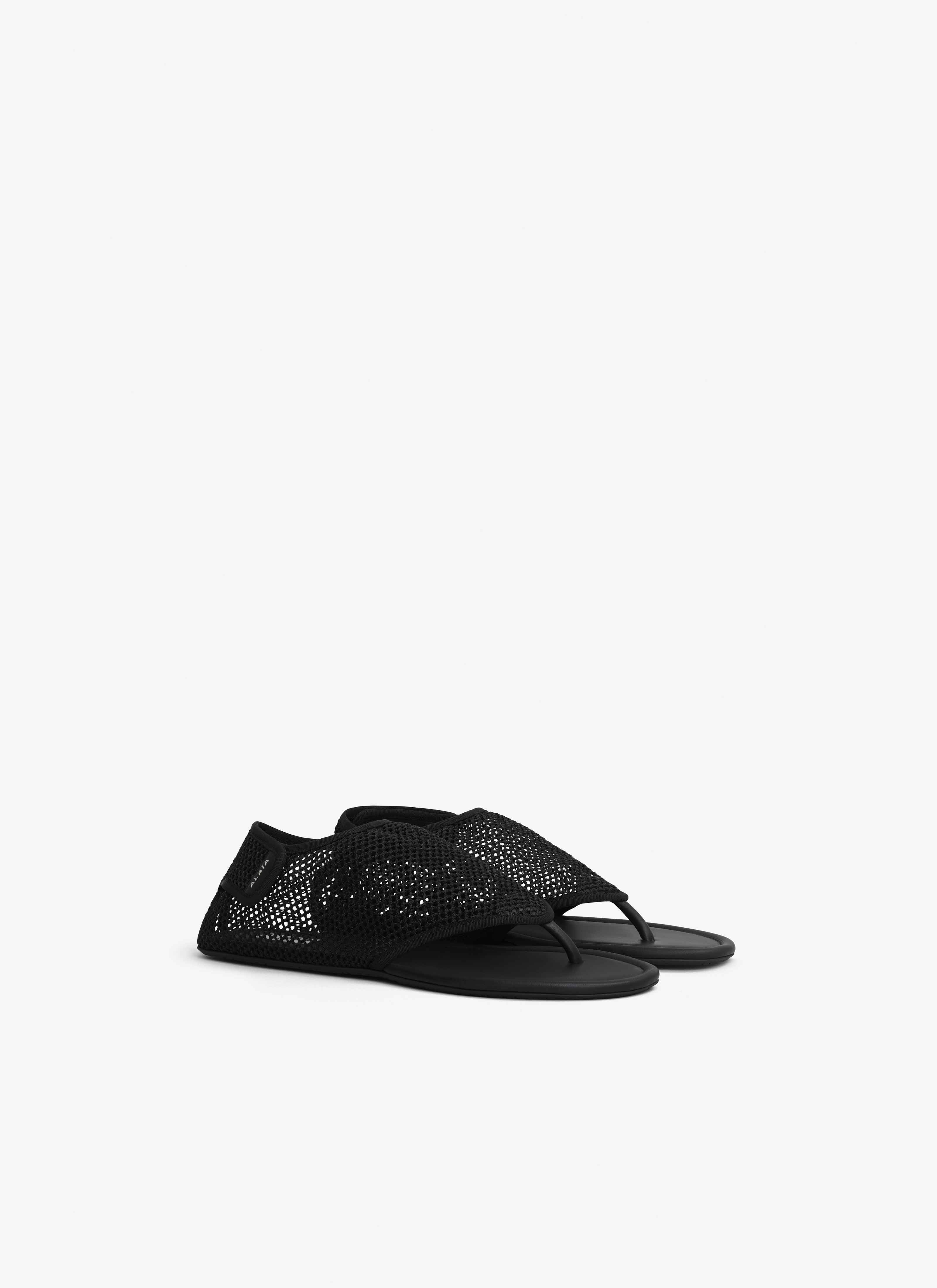 ALAÏA BLACK THONG SANDALS IN FISHNET