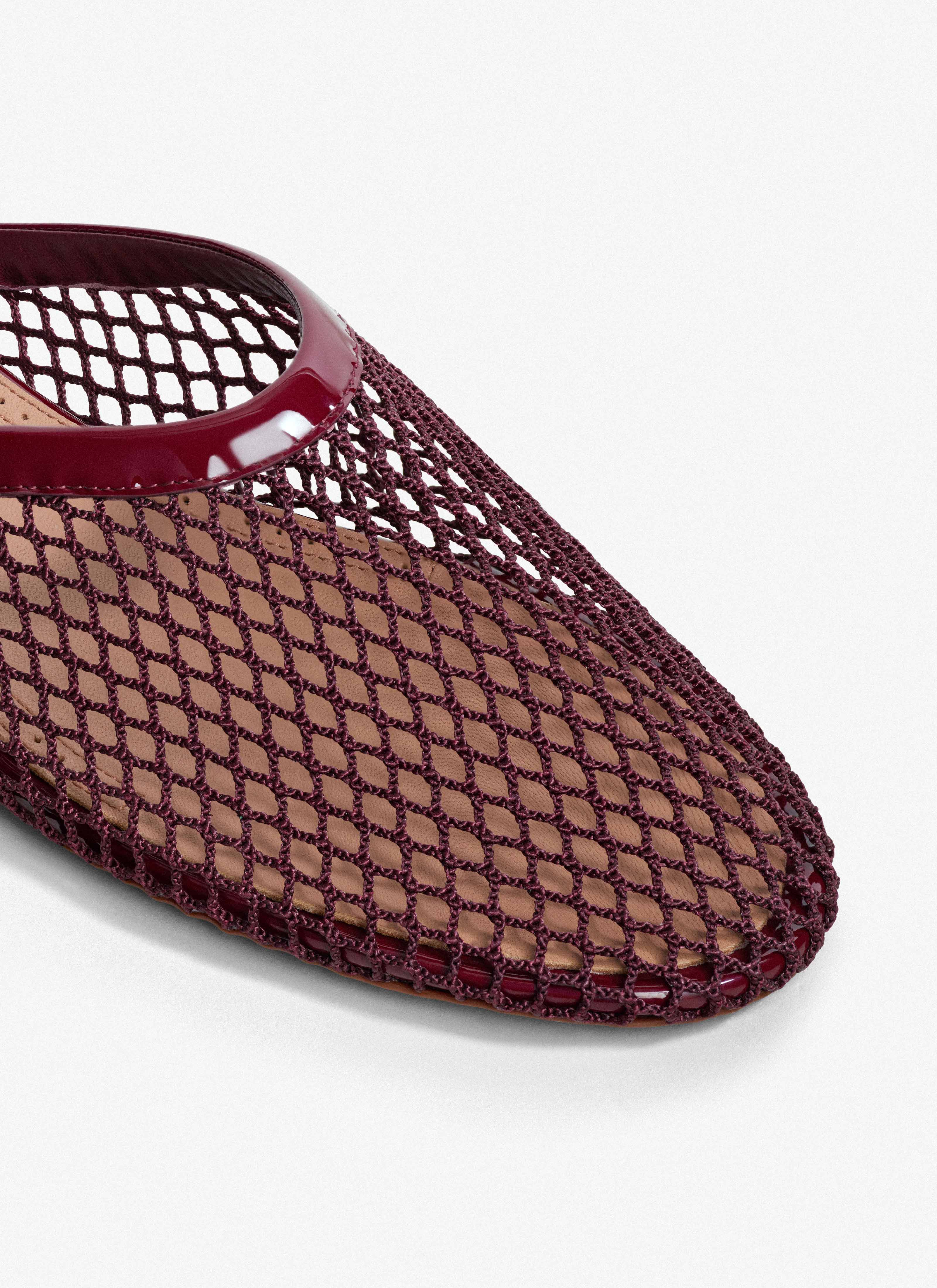 ALAÏA DARK RED FLAT MULES IN FISHNET