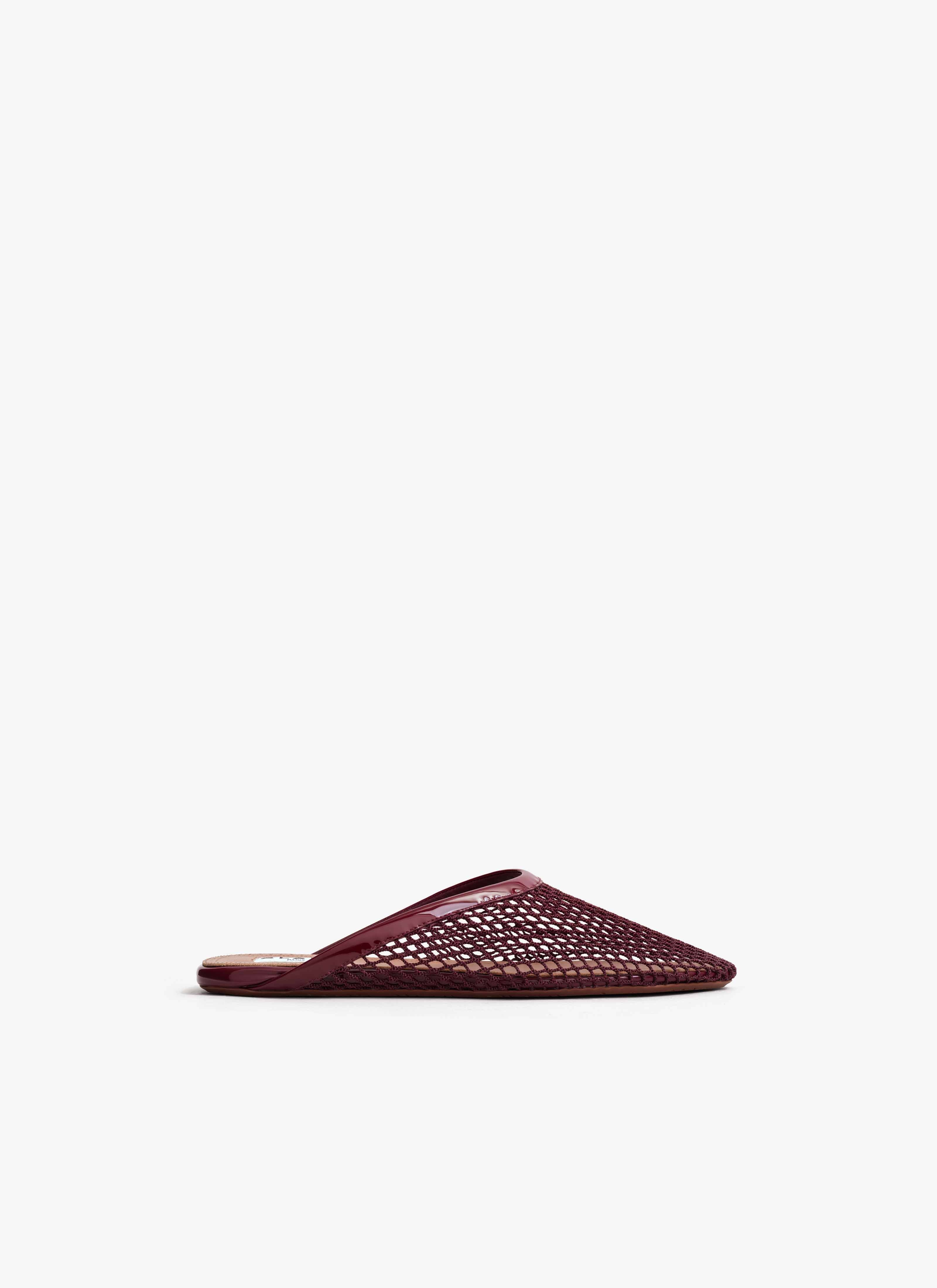 ALAÏA DARK RED FLAT MULES IN FISHNET
