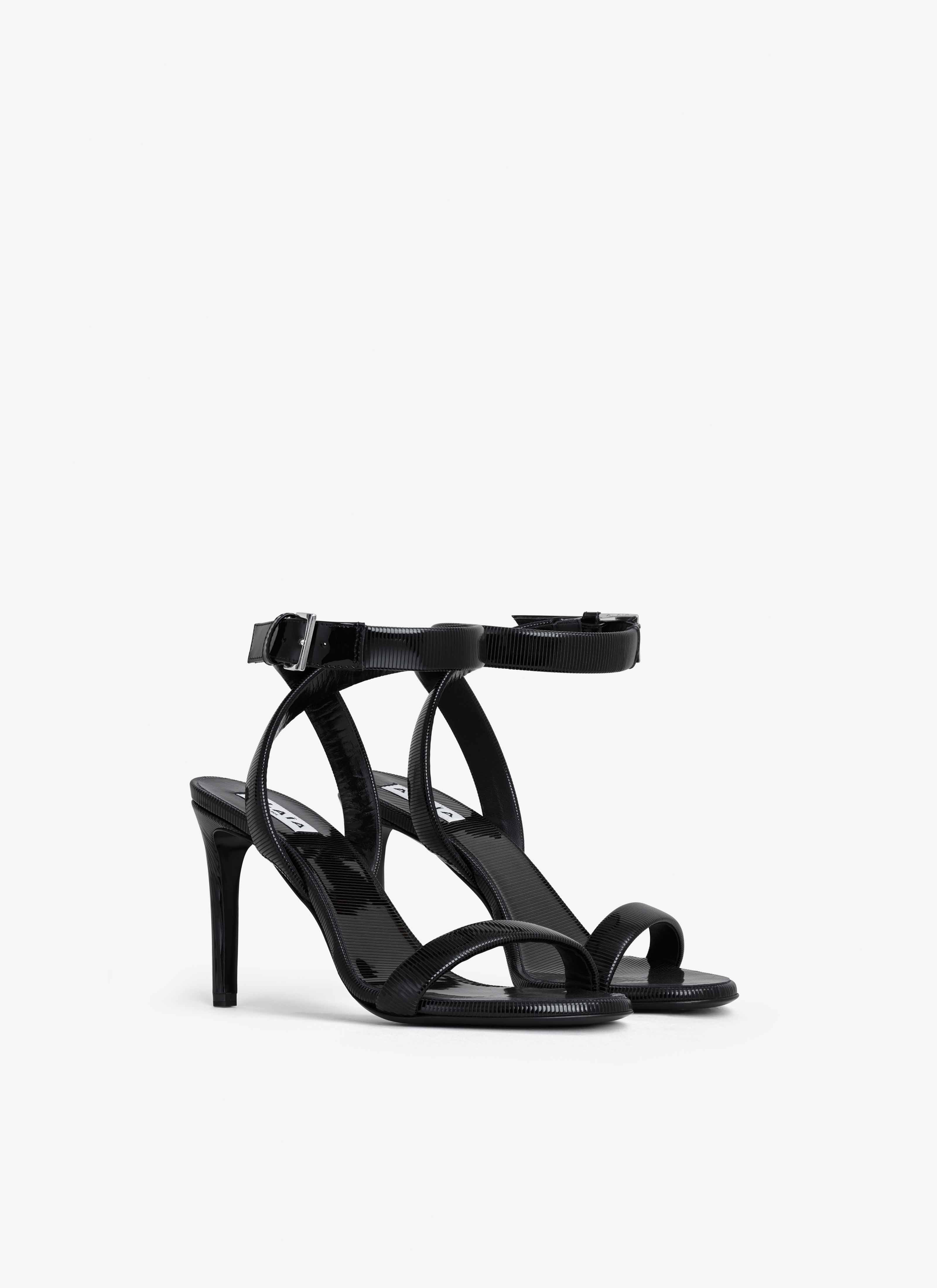 ALAÏA BLACK CHAIN SANDALS IN PATENT CALFSKIN