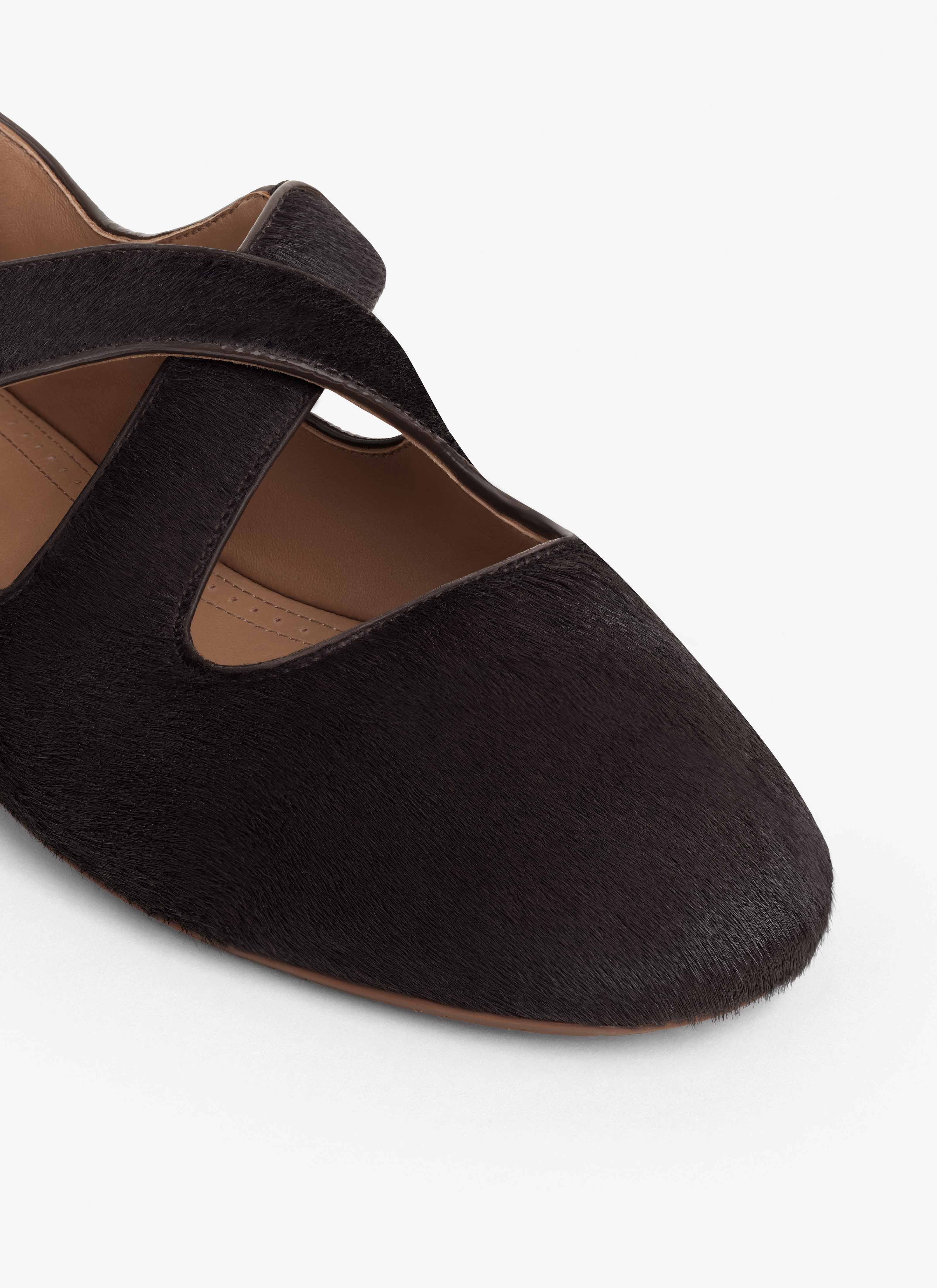 ALAÏA CHOCOLATE CRISS CROSS BALLET FLATS IN HAIRCALF
