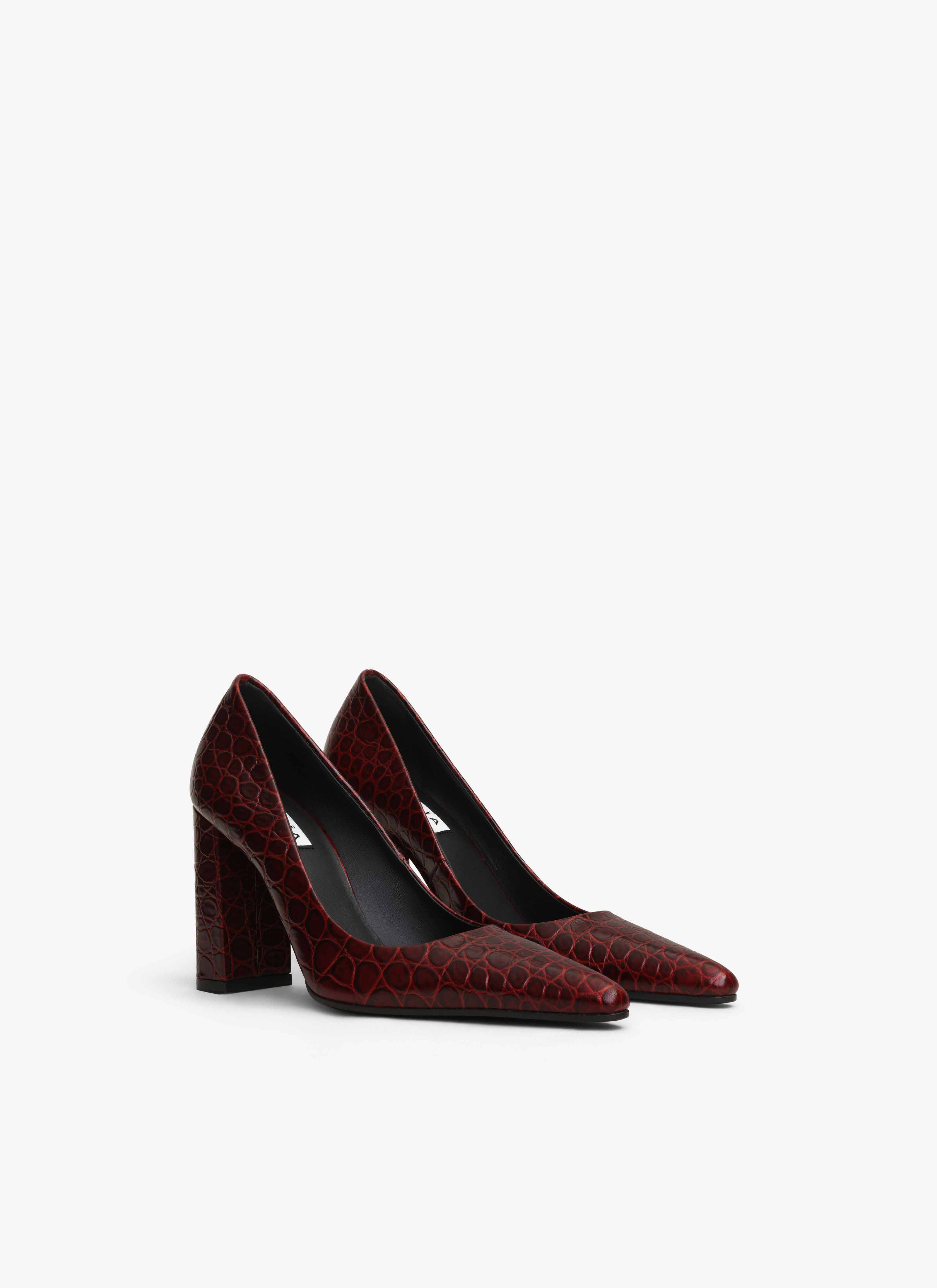 ALAÏA GARNET RED POINTY TOE PUMPS IN CALFSKIN