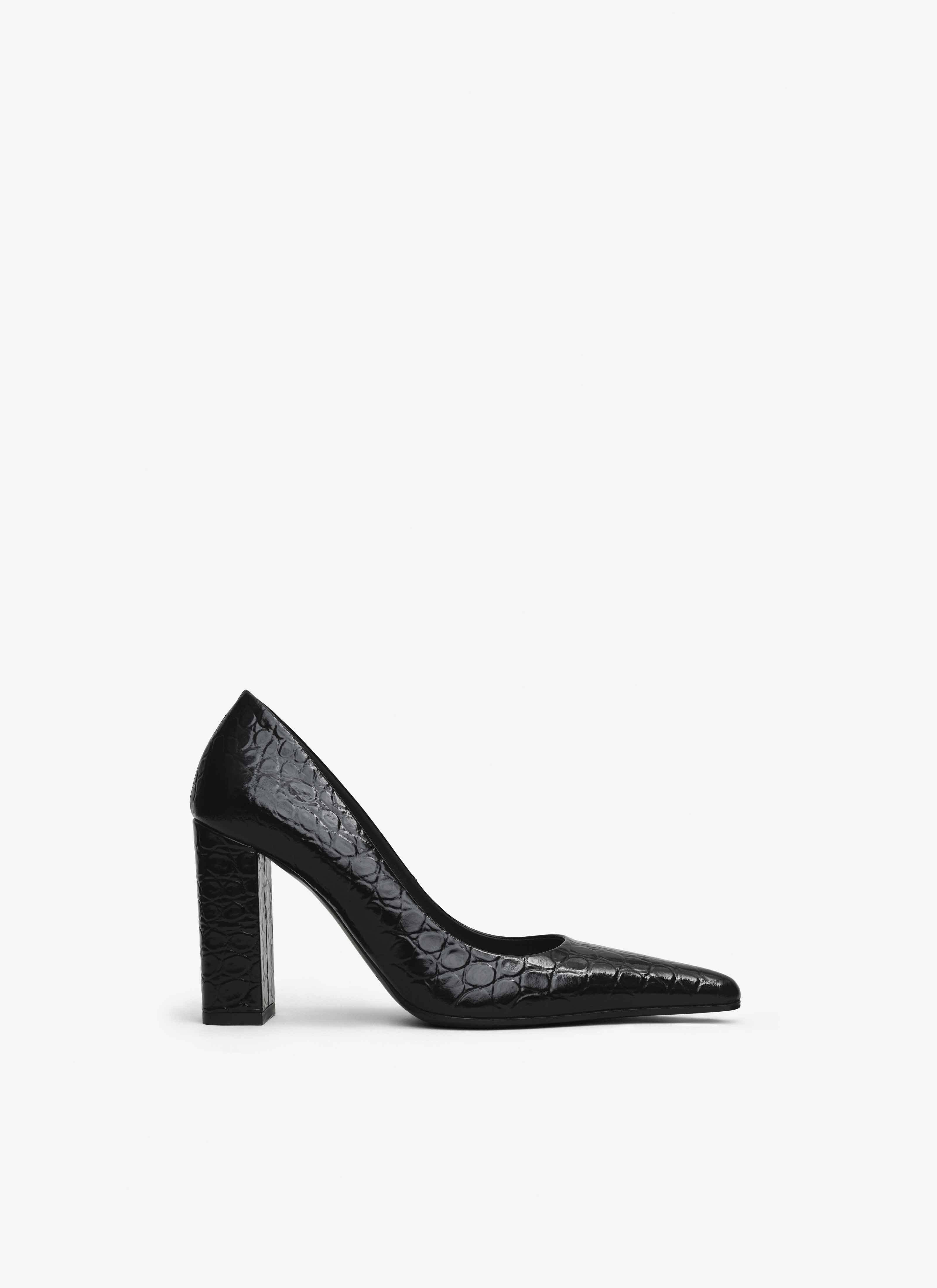 ALAÏA BLACK POINTY TOE PUMPS IN CALFSKIN