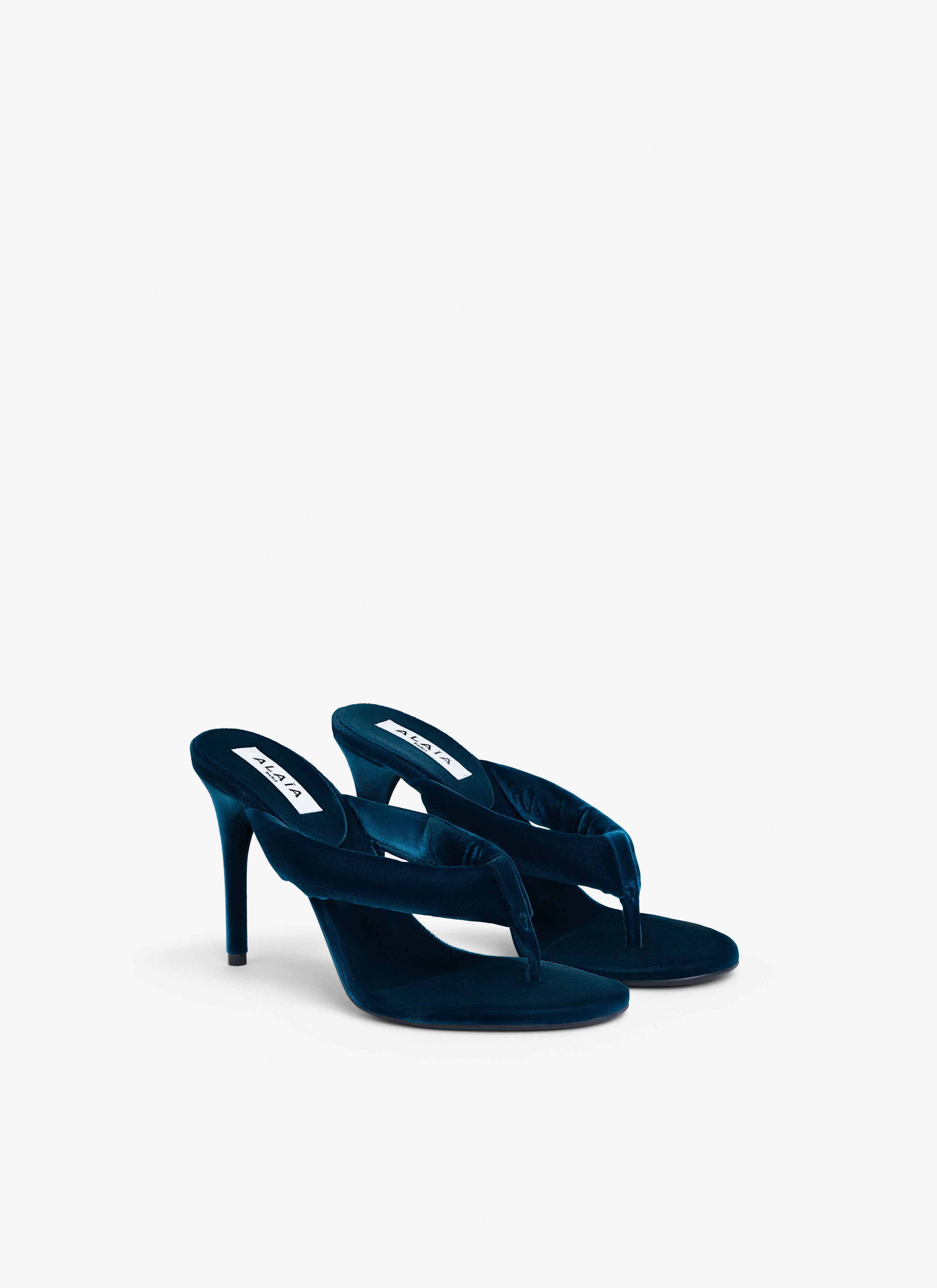 ALAÏA DARK PETROL HEEL THONG MULES IN VELVET