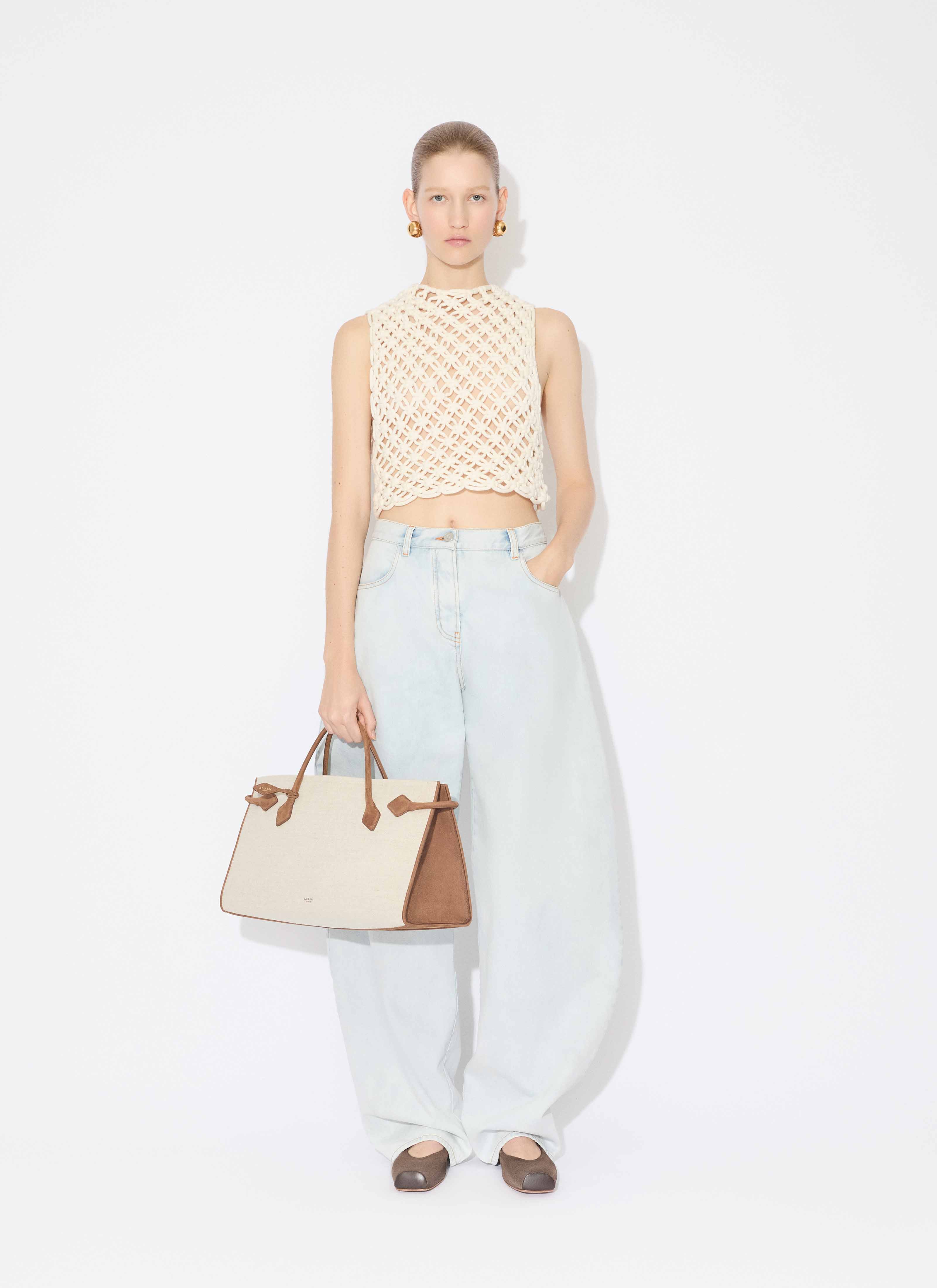 ALAÏA LIGHT BLUE LOW WAIST ROUND JEANS