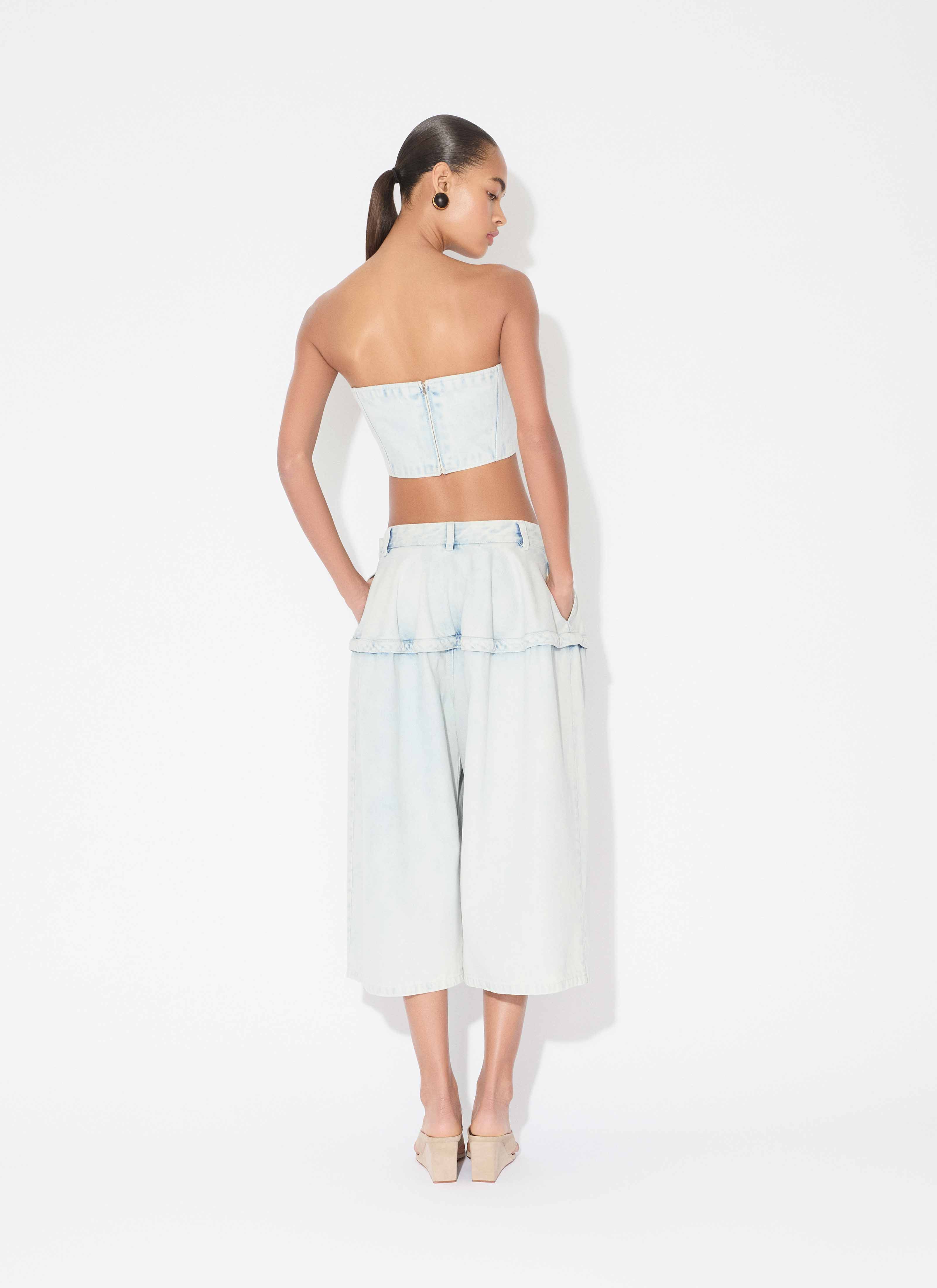 ALAÏA LIGHT BLUE PEPLUM BERMUDAS