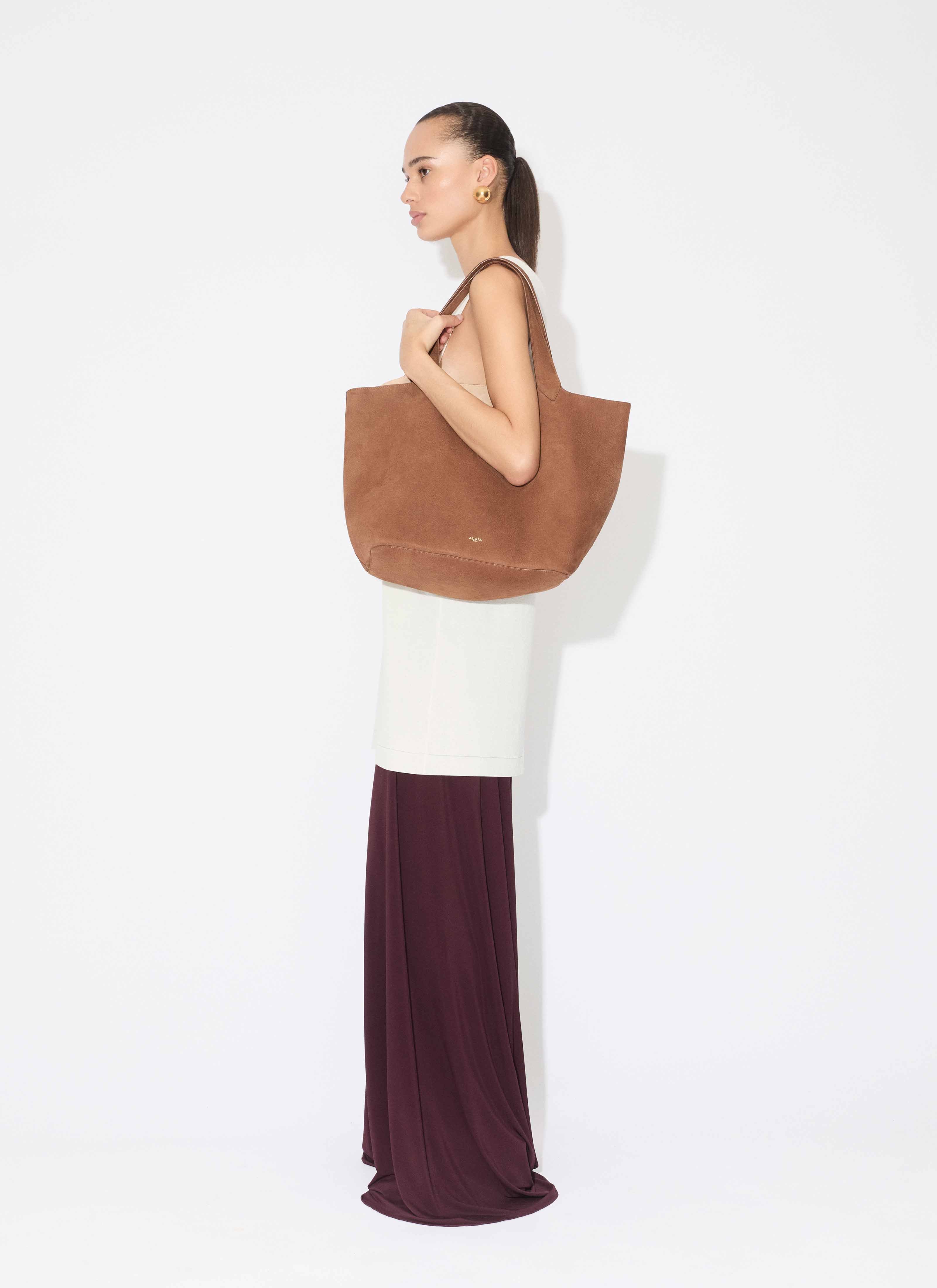 ALAÏA BURGUNDY SOFT JERSEY BUSTIER JUMPSUIT