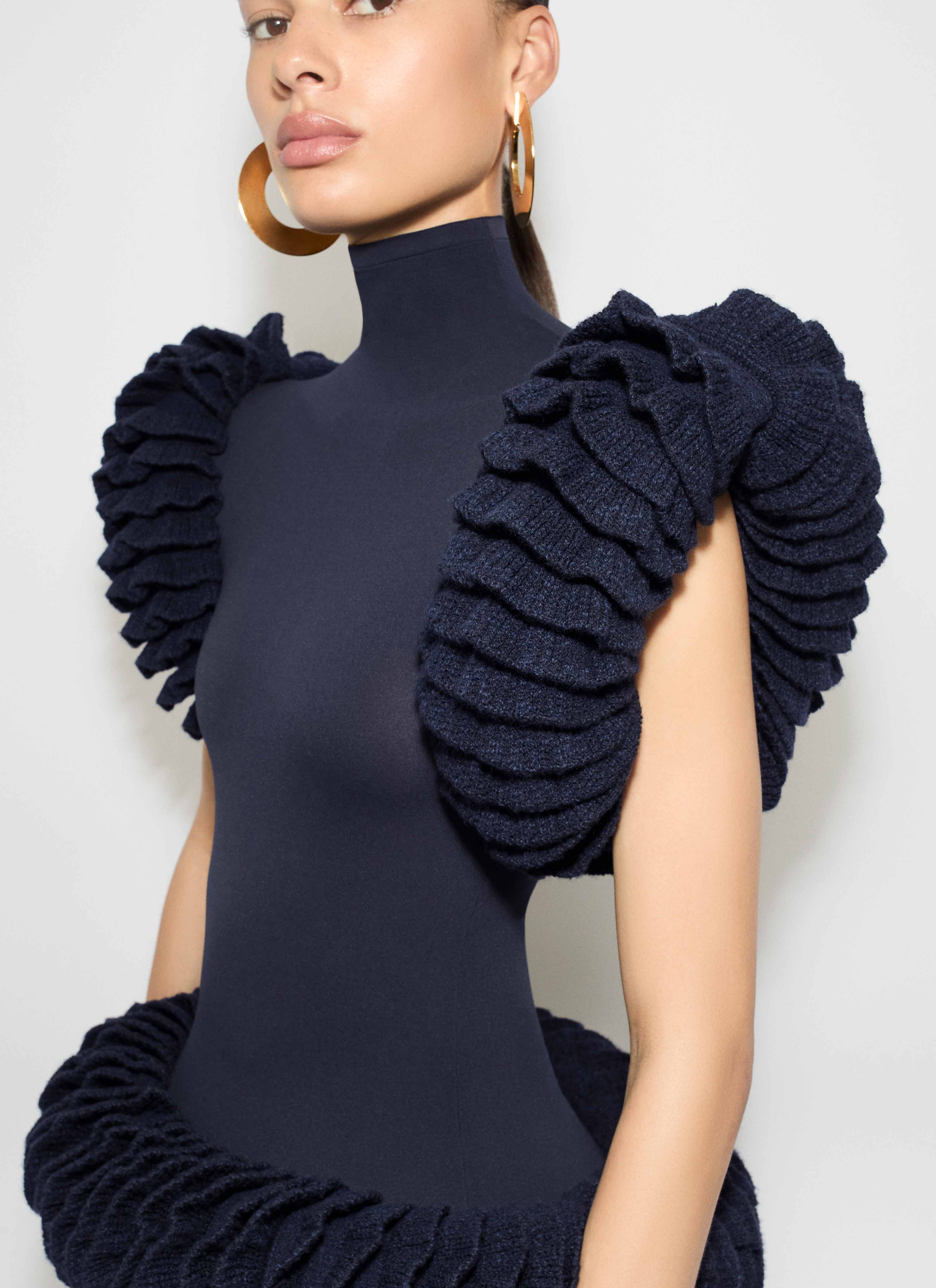 ALAÏA MARINE TWEED KNIT RUFFLE TOP