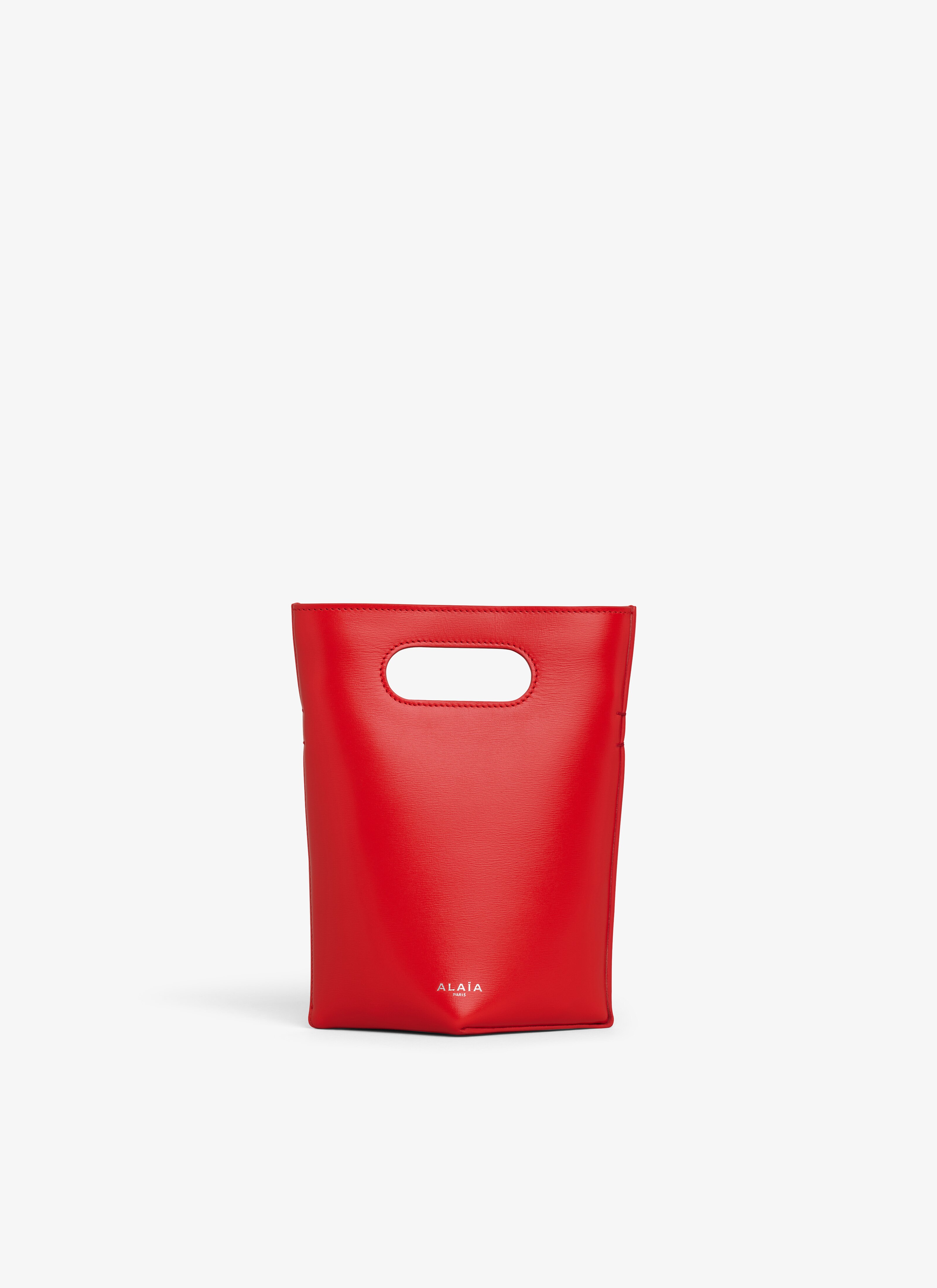 ALAÏA RED FOLDED SMALL BAG IN CALFSKIN
