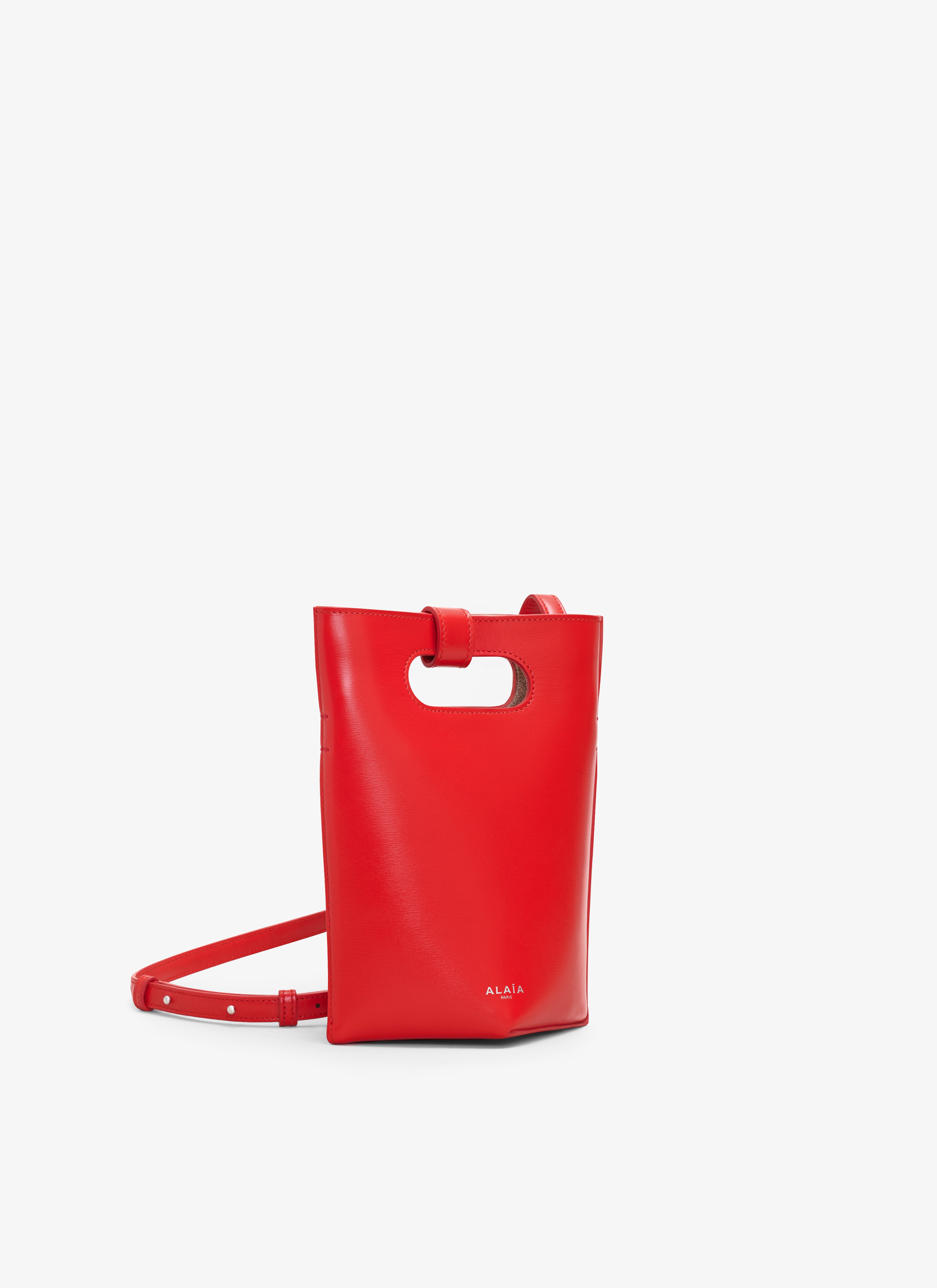 ALAÏA RED FOLDED SMALL BAG IN CALFSKIN