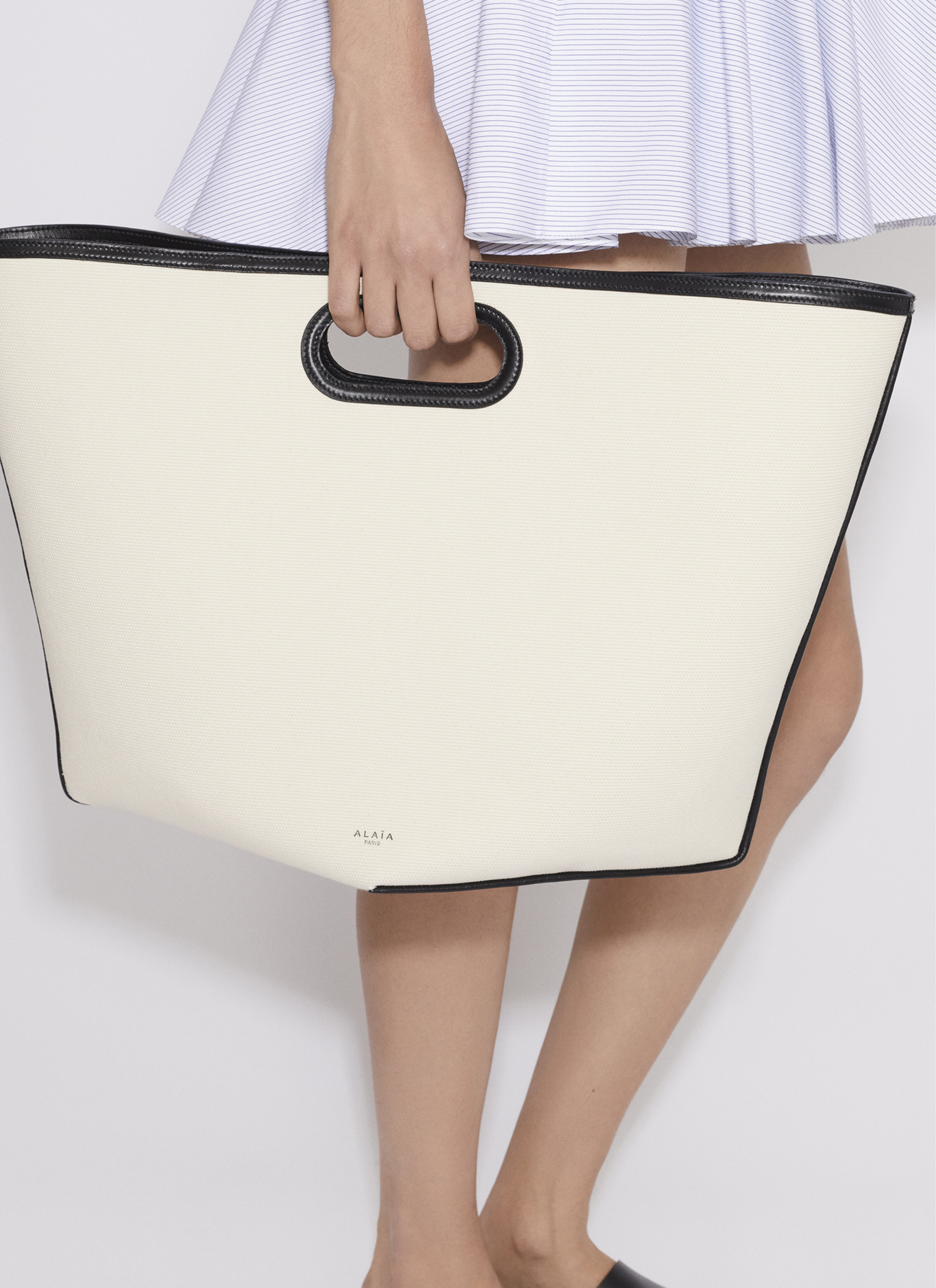 ALAÏA ECRU FOLDED LARGE BAG IN CANVAS