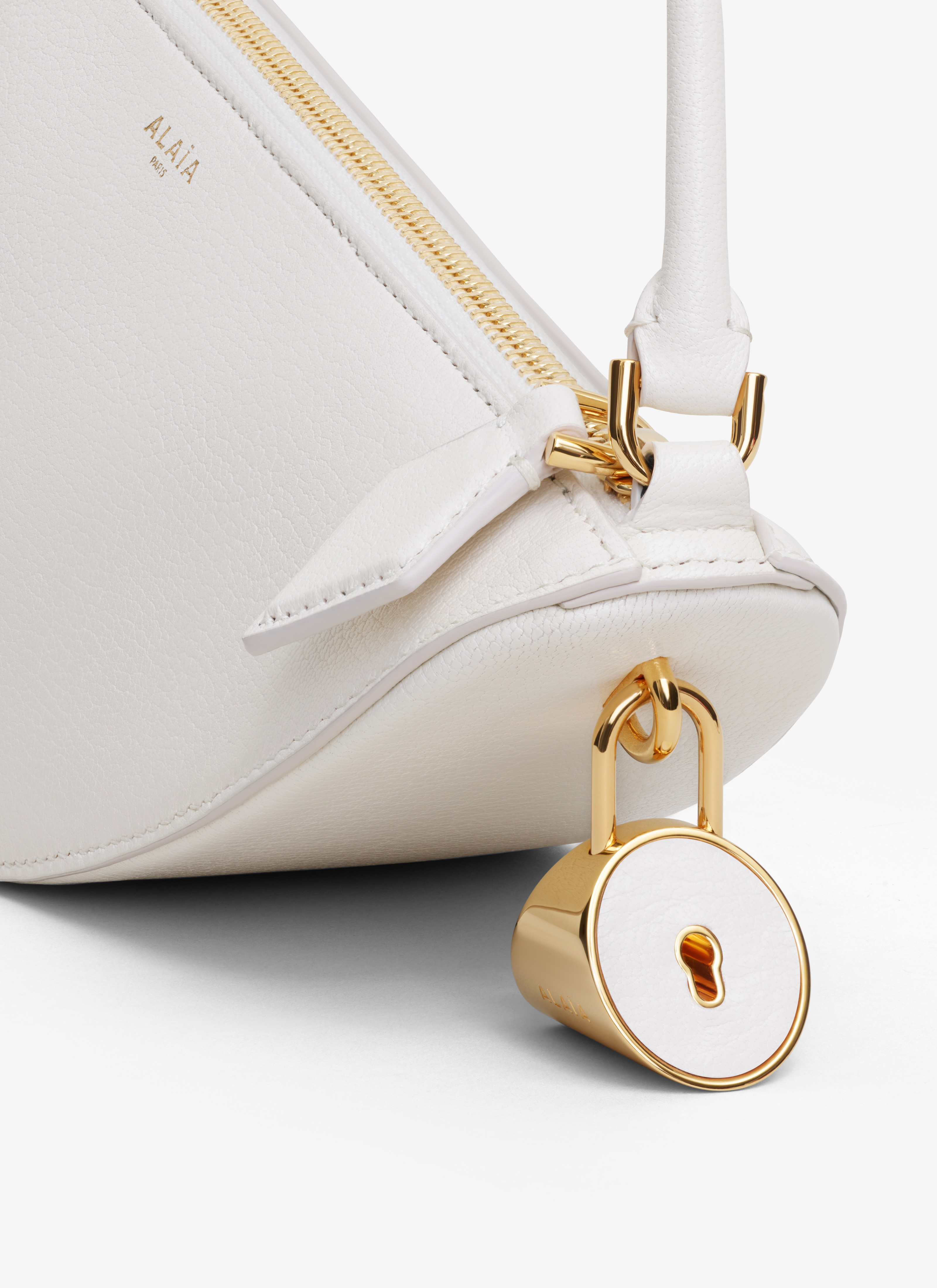 ALAÏA IVORY LE DEMI-CŒUR BAG IN GOATSKIN