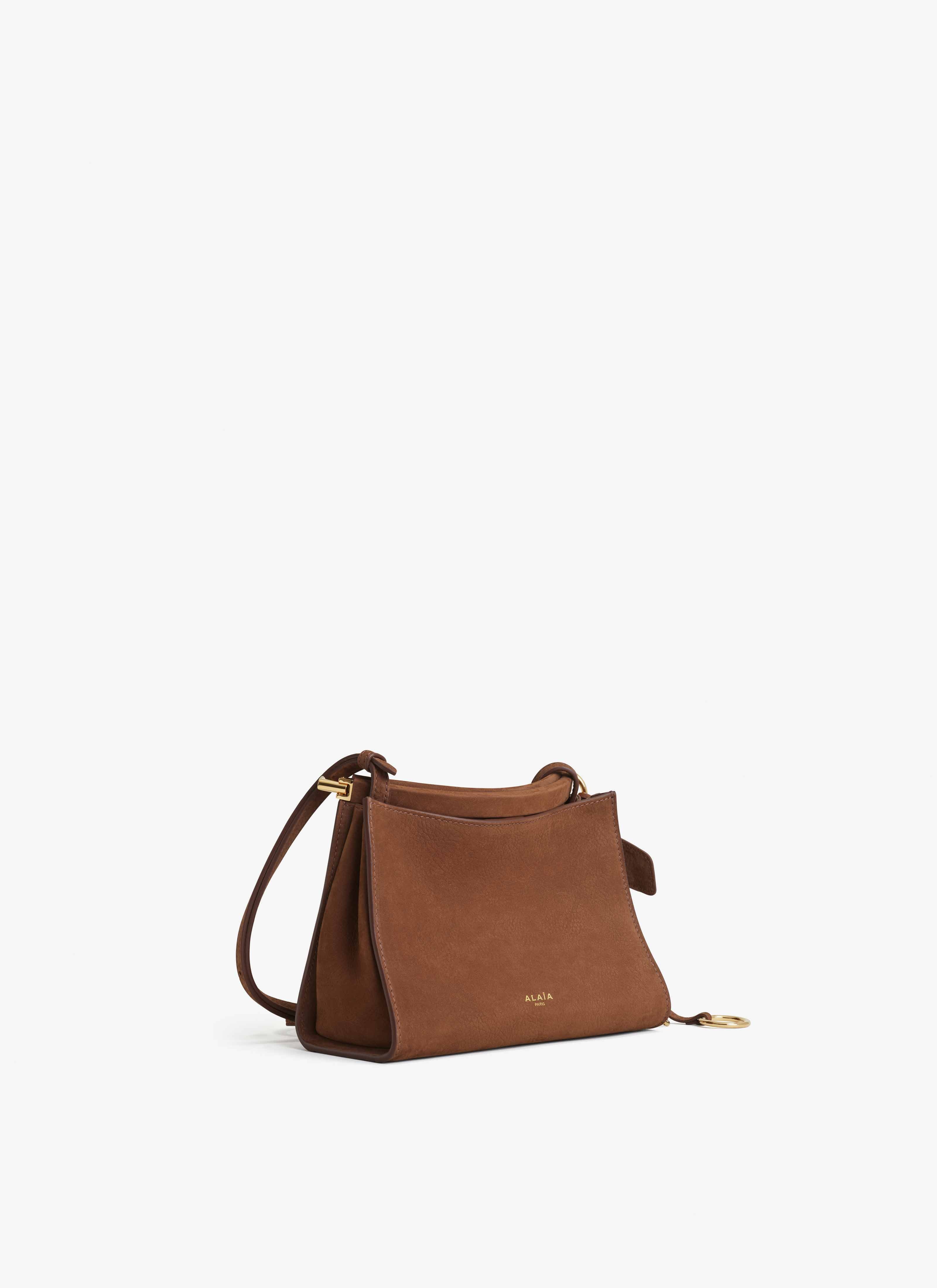 ALAÏA UMBER LE CLICK SMALL SQUARE BAG IN NUBUCK 