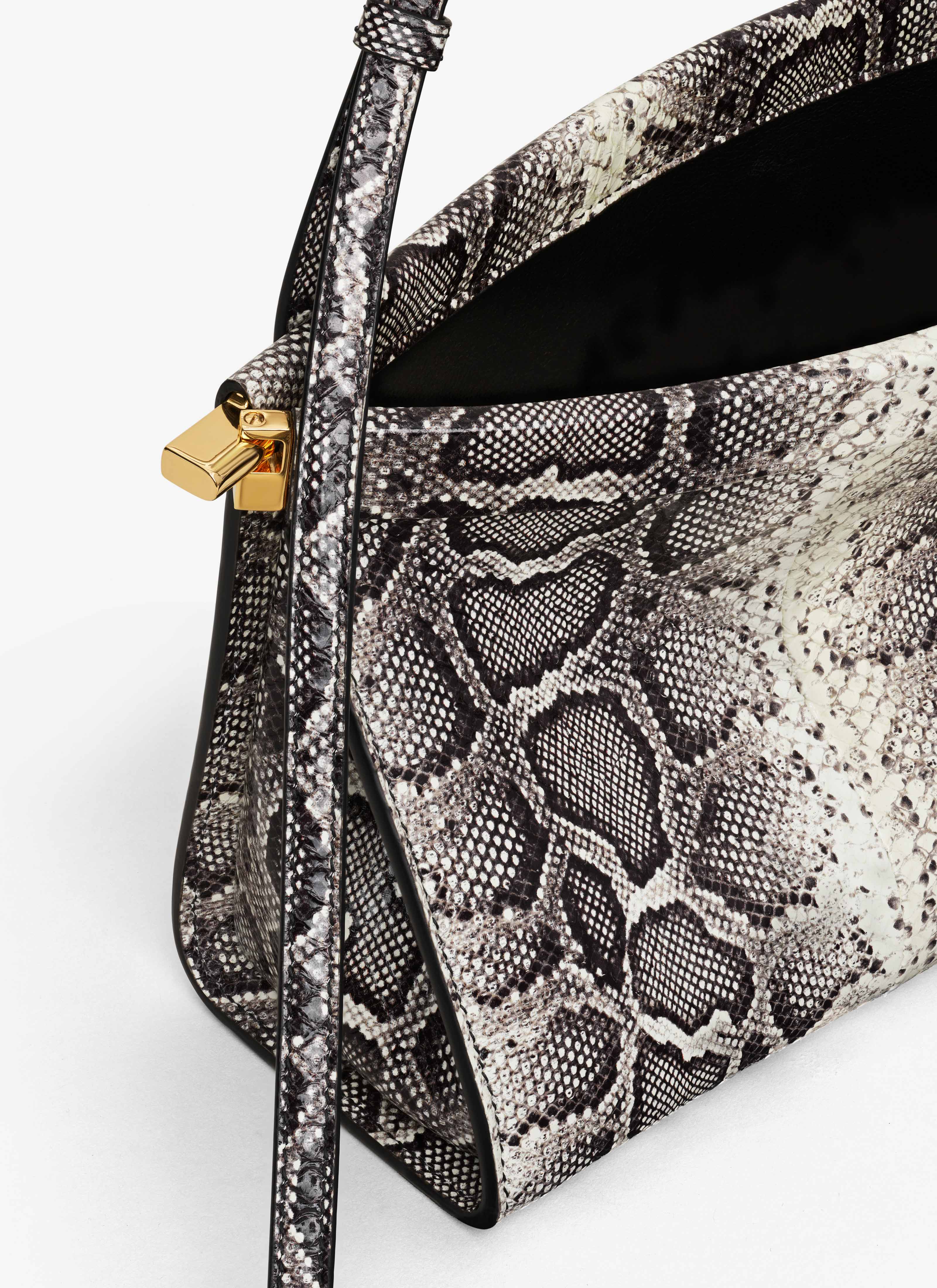 ALAÏA WHITE/BLACK LE CLICK EAST WEST MEDIUM BAG IN AYERS LEATHER