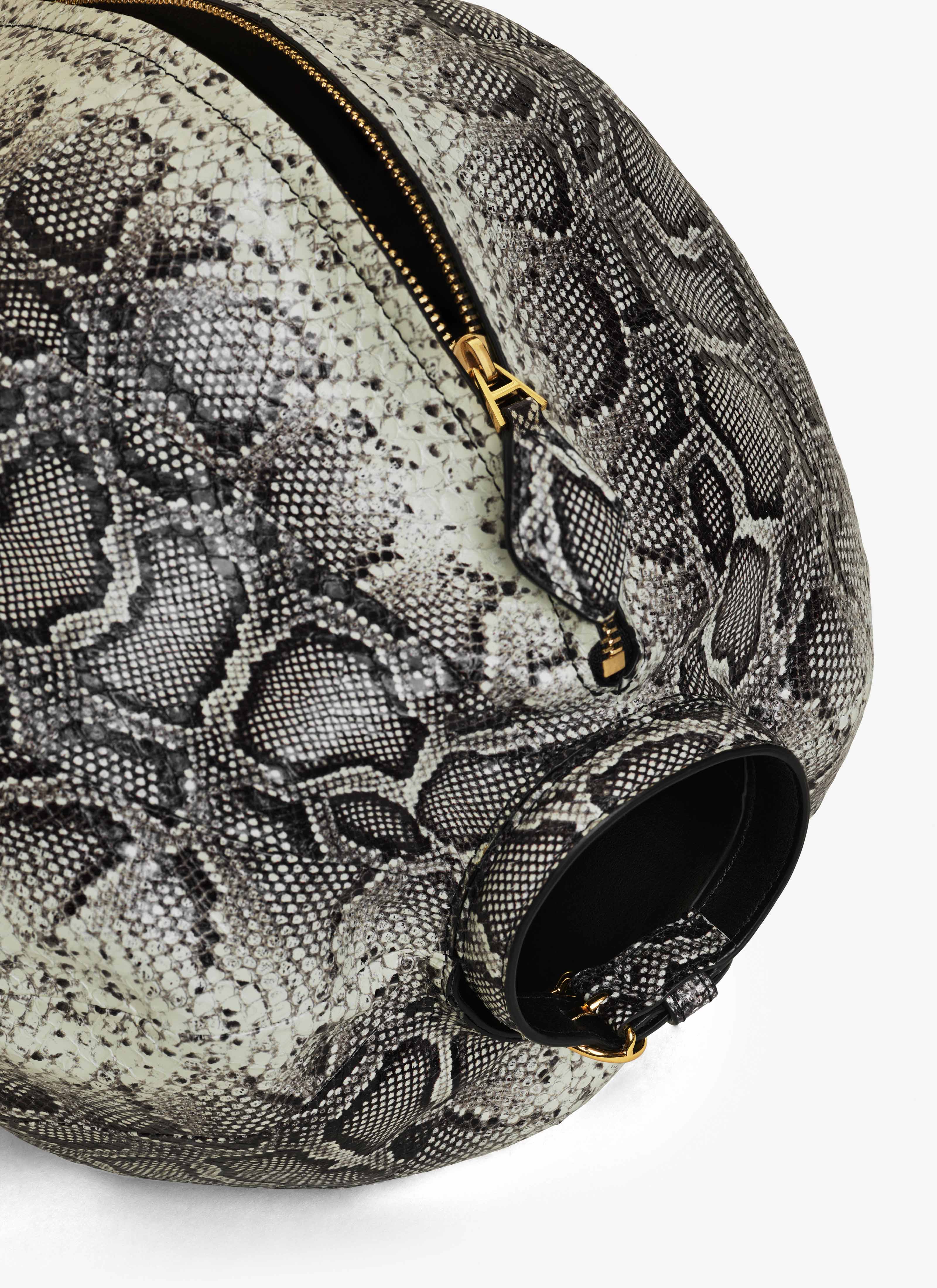 ALAÏA WHITE/BLACK SPHERE BRACELET BAG IN AYERS