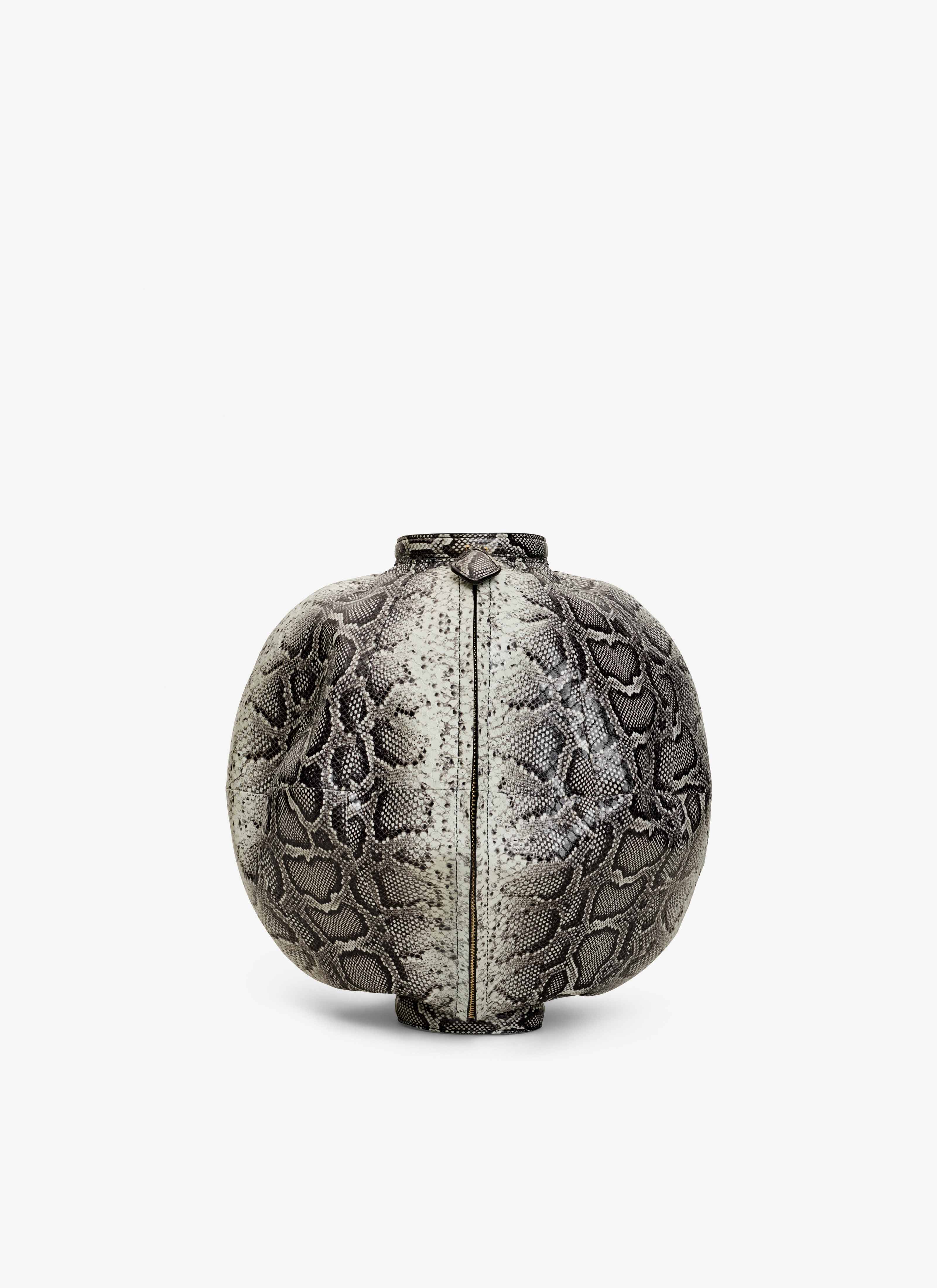 ALAÏA WHITE/BLACK SPHERE BRACELET BAG IN AYERS