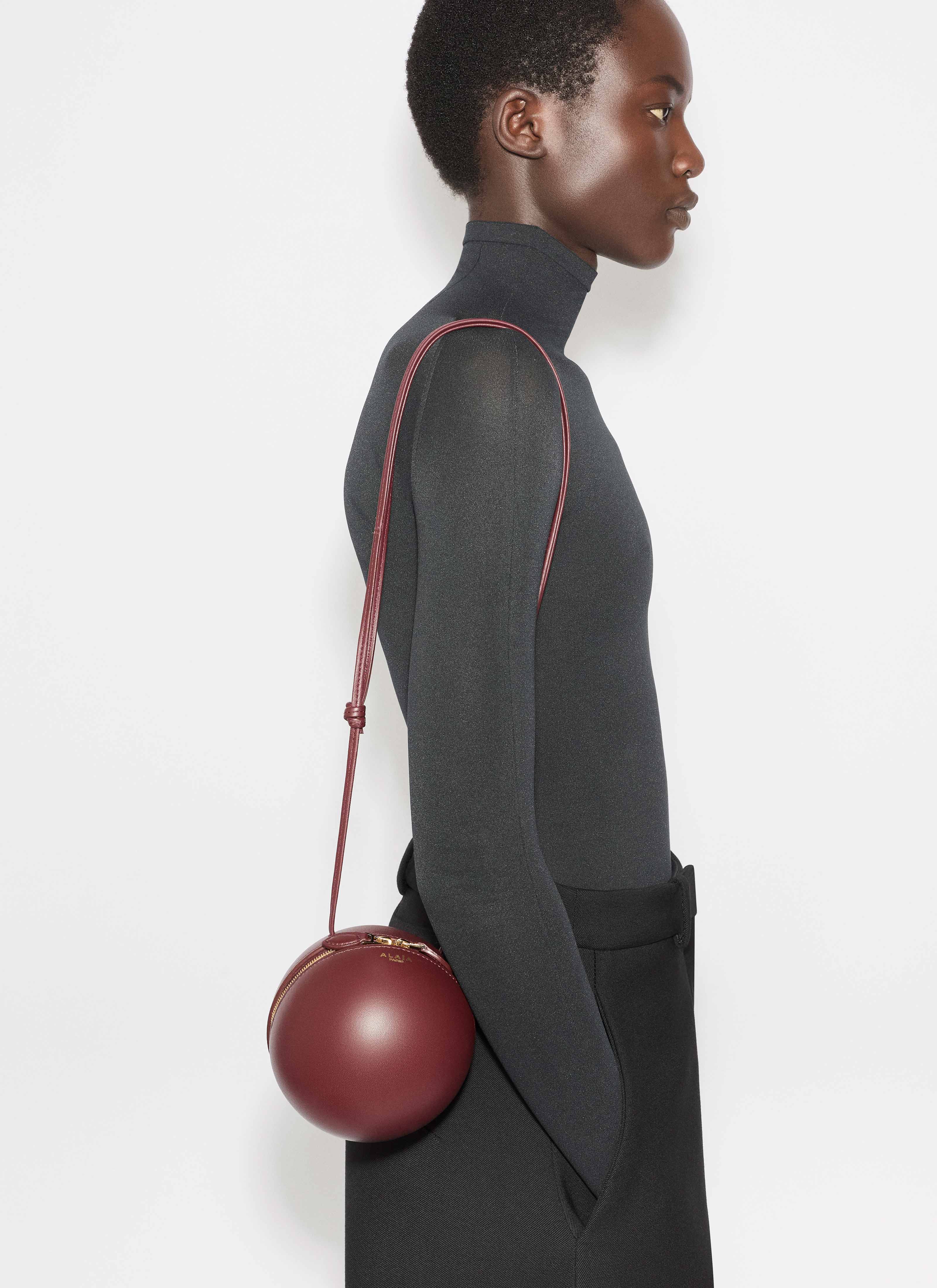 ALAÏA GARNET RED SPHERE BAG IN LAMBSKIN