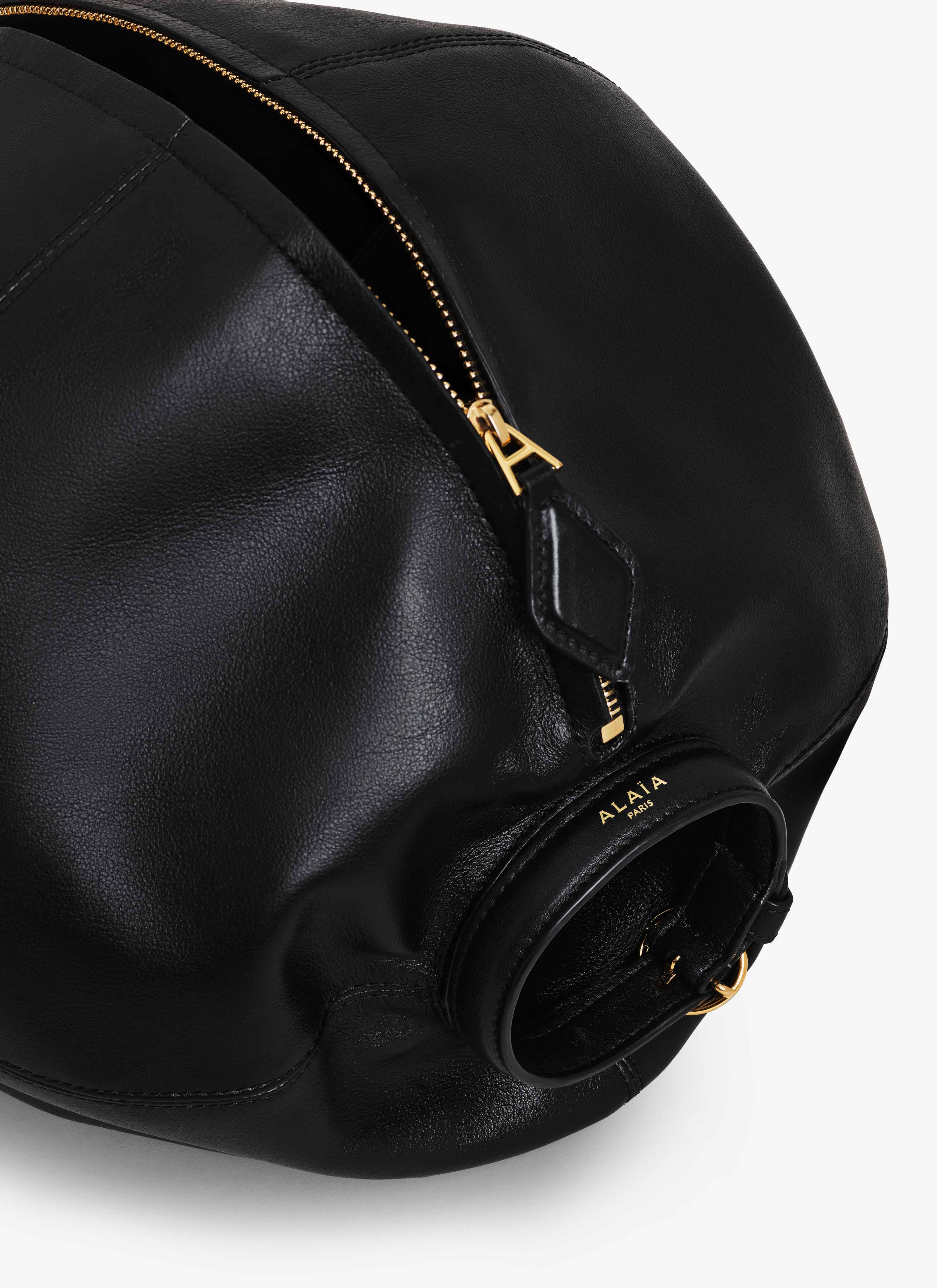 ALAÏA BLACK SPHERE BRACELET BAG IN CALFSKIN