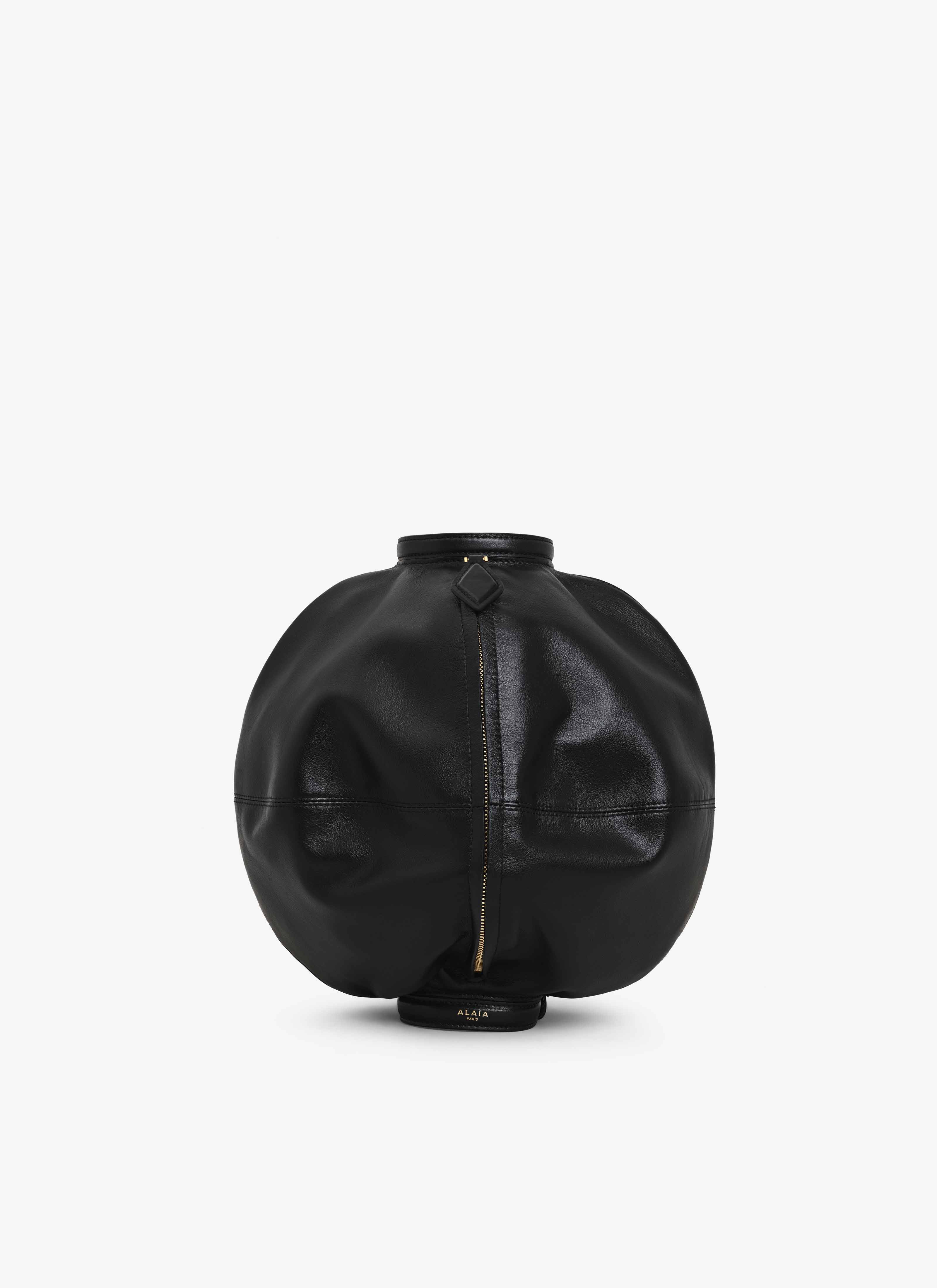 ALAÏA BLACK SPHERE BRACELET BAG IN CALFSKIN
